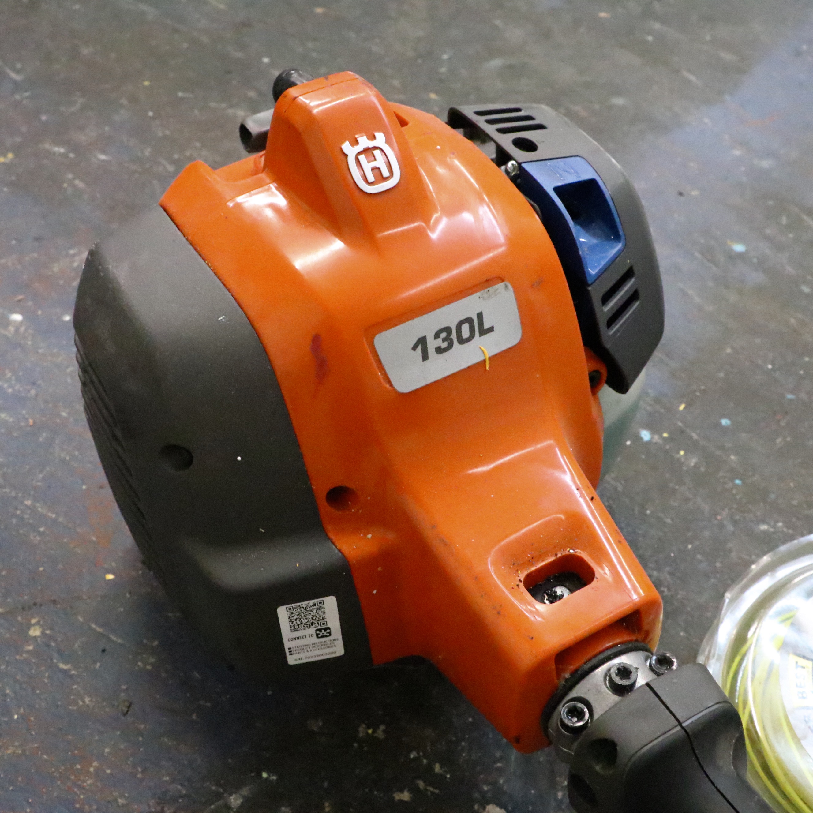 Truper Wheelbarrow With Husqvarna Gas-Powered String Trimmer