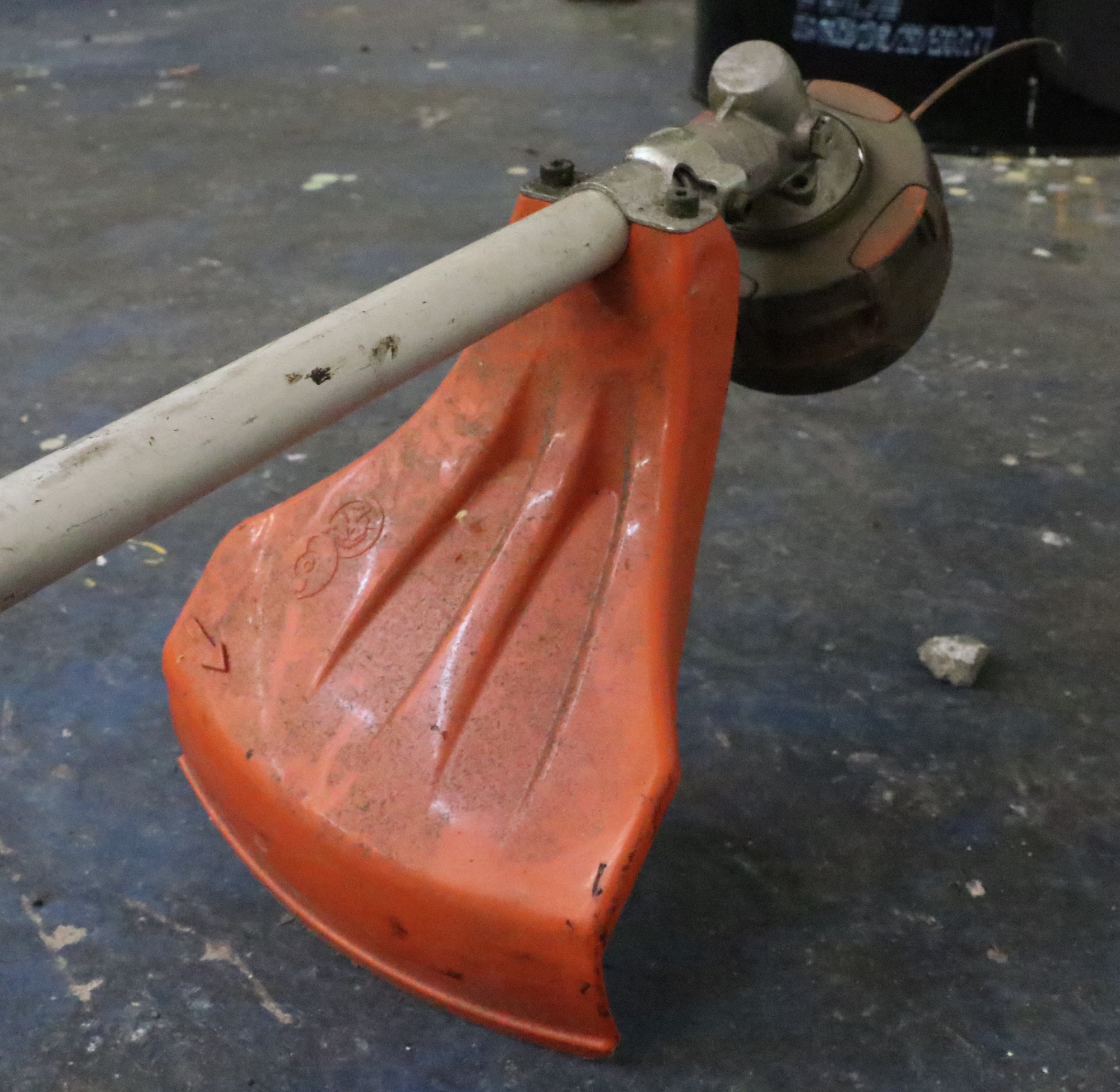 Truper Wheelbarrow With Husqvarna Gas-Powered String Trimmer