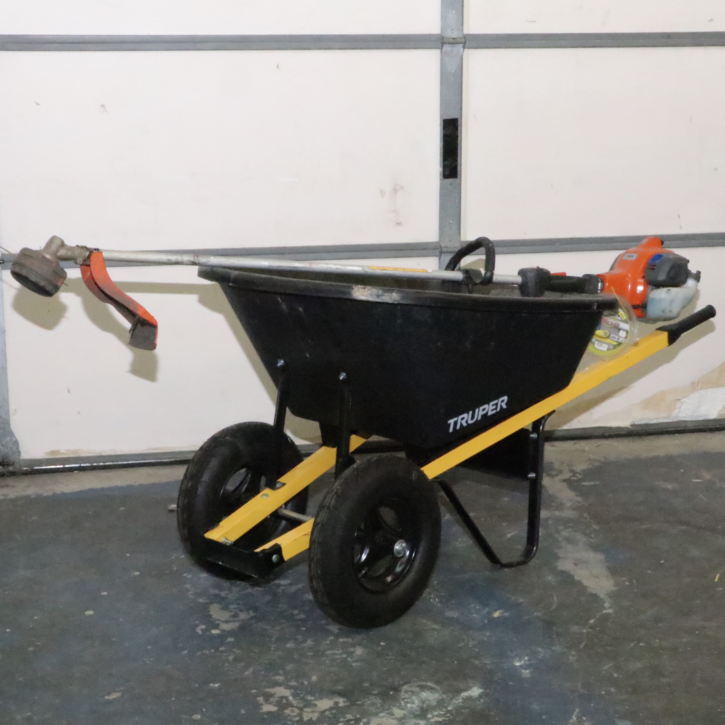 Truper Wheelbarrow With Husqvarna Gas-Powered String Trimmer