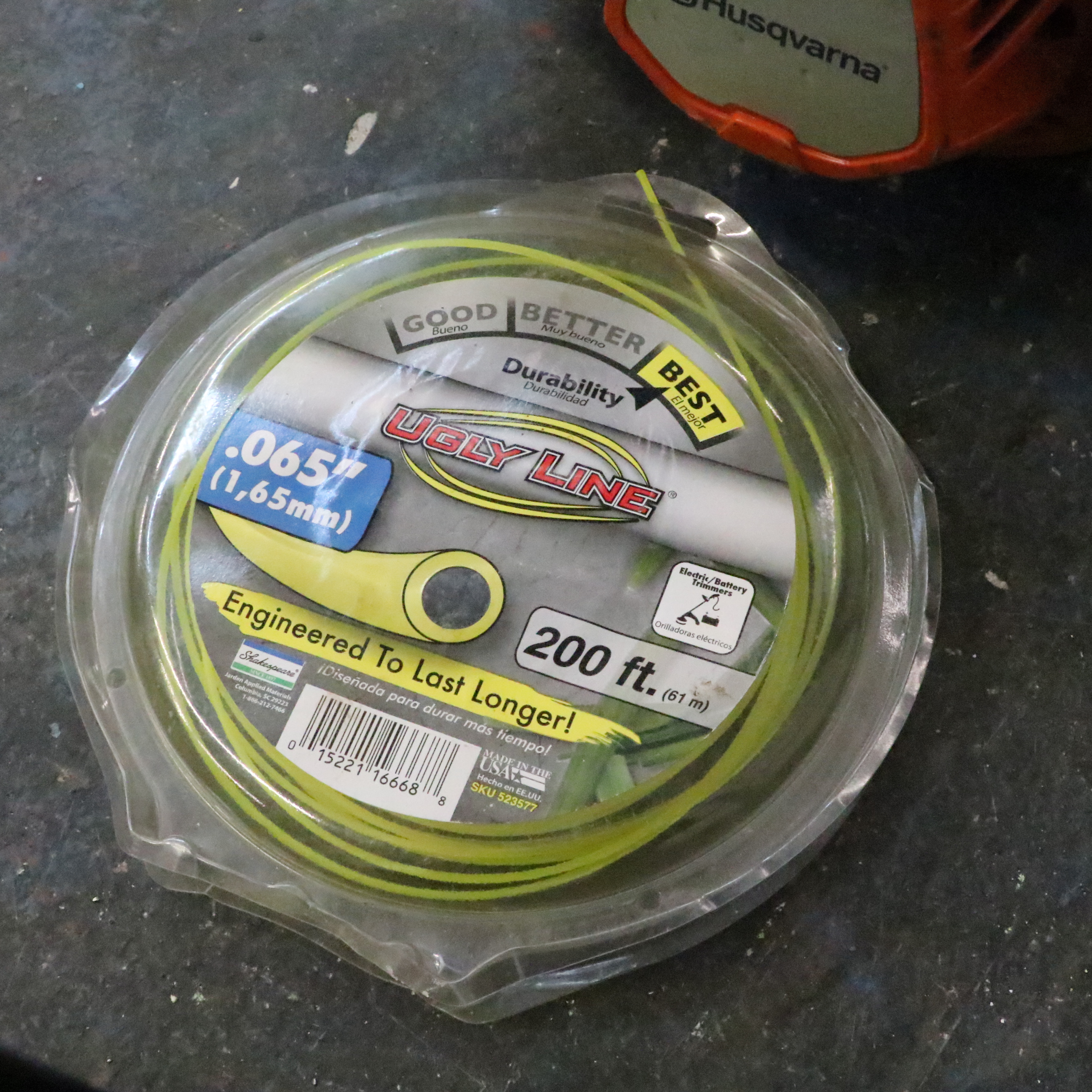 Truper Wheelbarrow With Husqvarna Gas-Powered String Trimmer