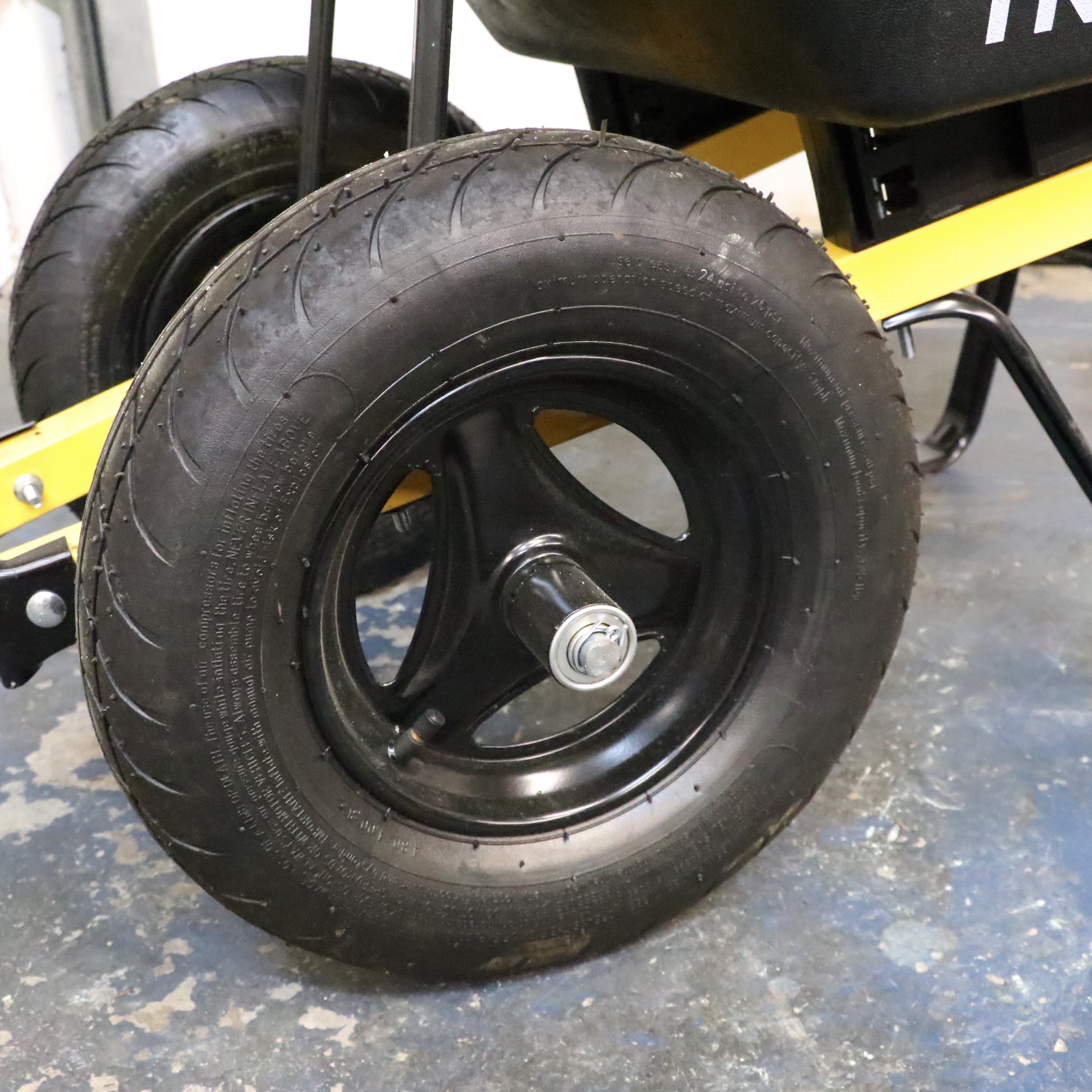 Truper Wheelbarrow With Husqvarna Gas-Powered String Trimmer