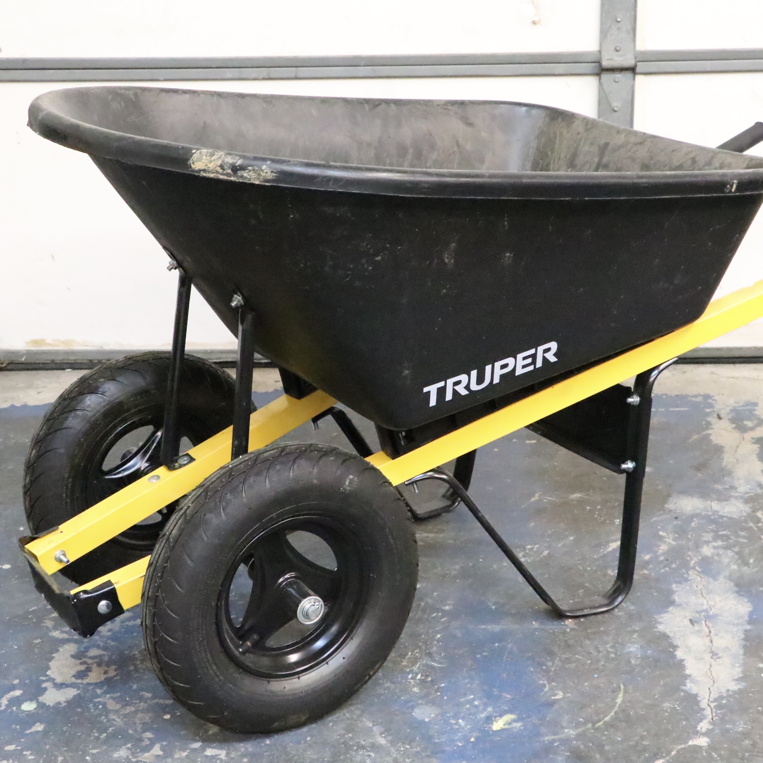 Truper Wheelbarrow With Husqvarna Gas-Powered String Trimmer