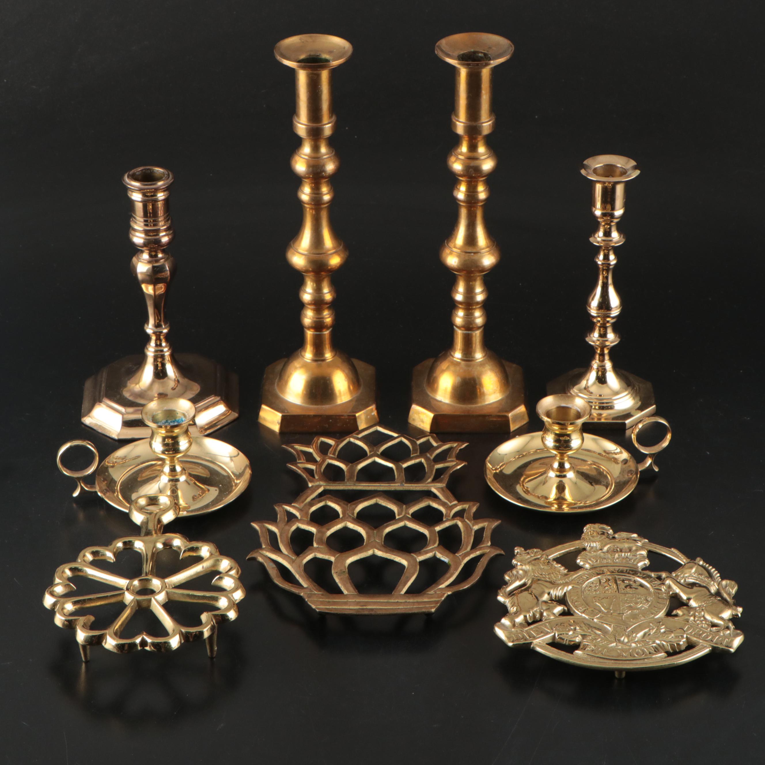 Virginia Metalcrafters "Kings Arms" with Other Brass Trivets and Candlesticks