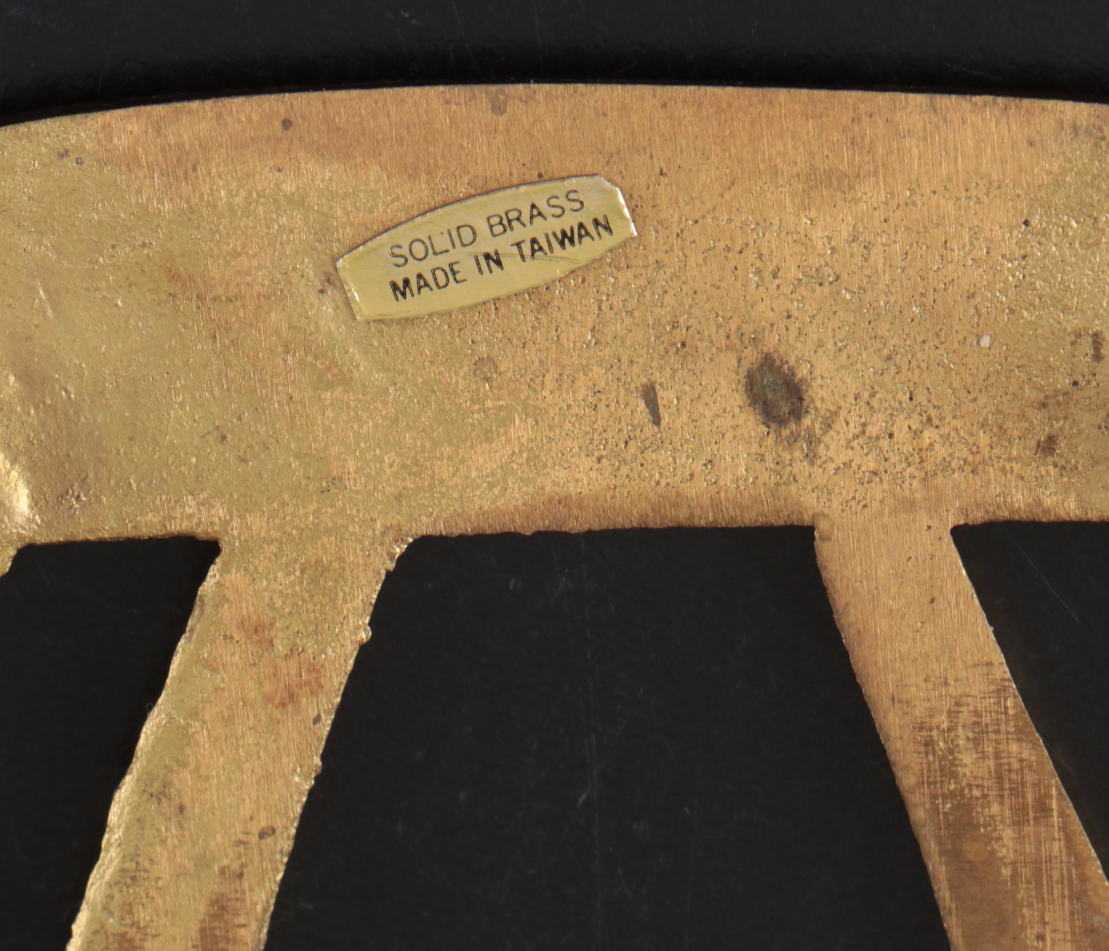 Virginia Metalcrafters "Kings Arms" with Other Brass Trivets and Candlesticks