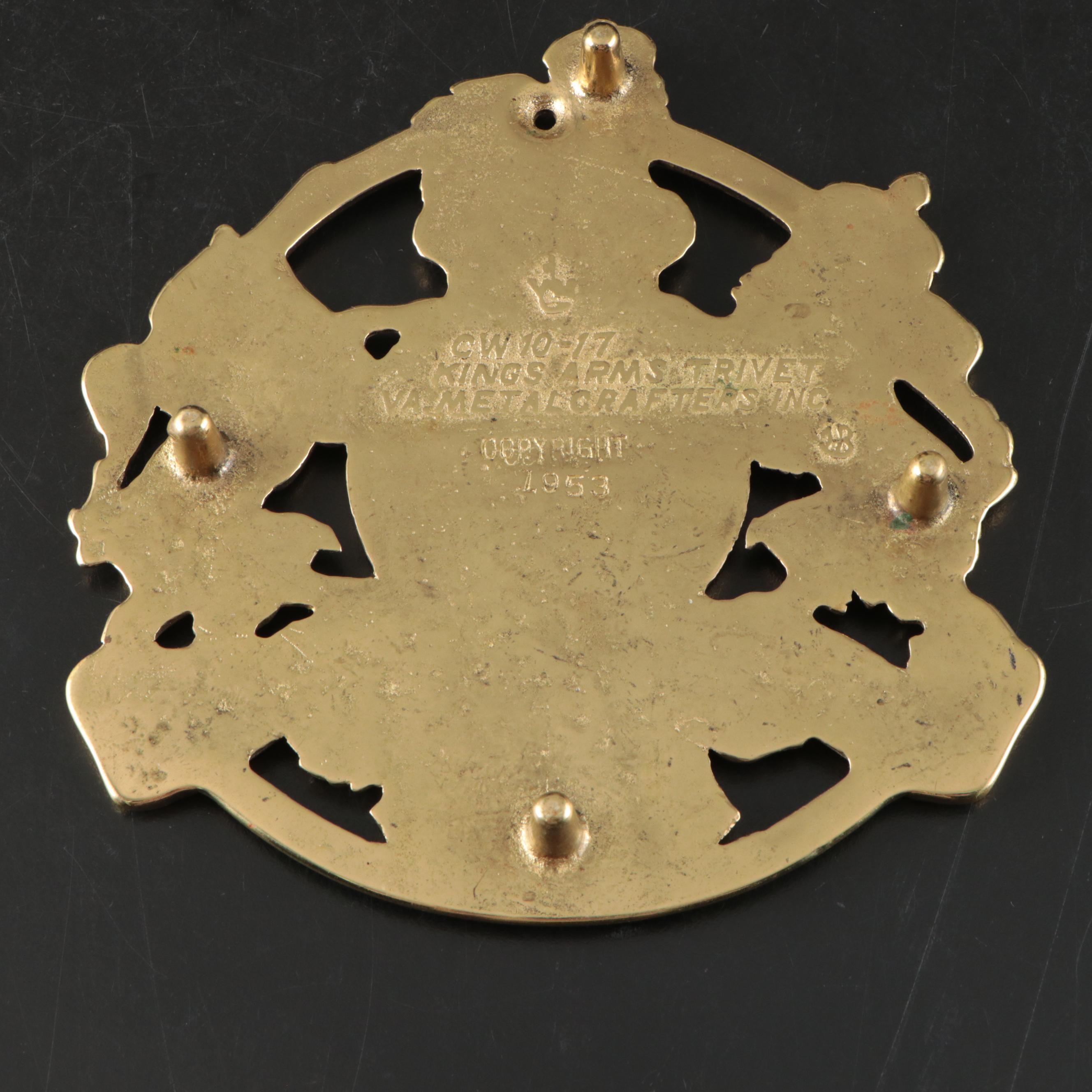 Virginia Metalcrafters "Kings Arms" with Other Brass Trivets and Candlesticks