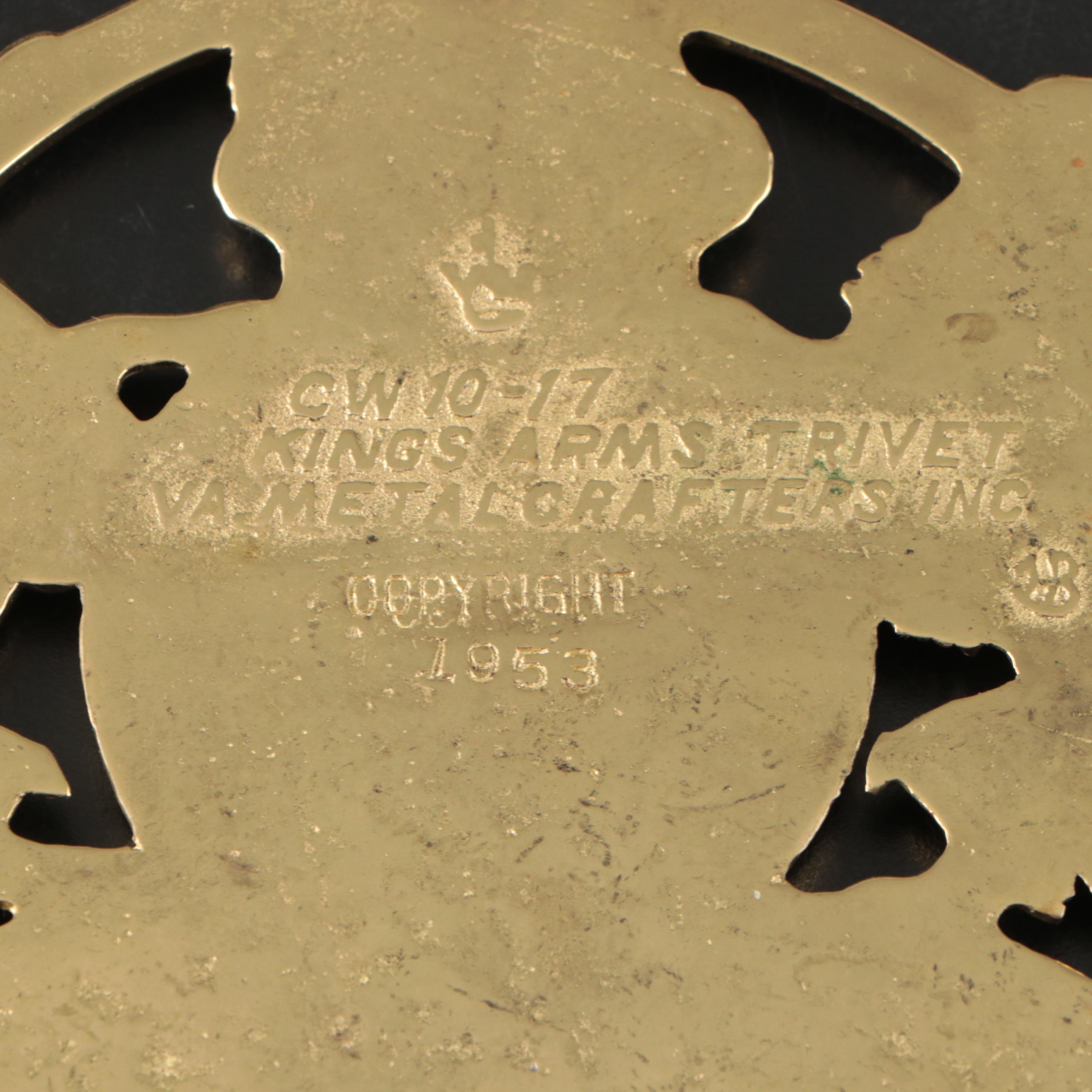 Virginia Metalcrafters "Kings Arms" with Other Brass Trivets and Candlesticks