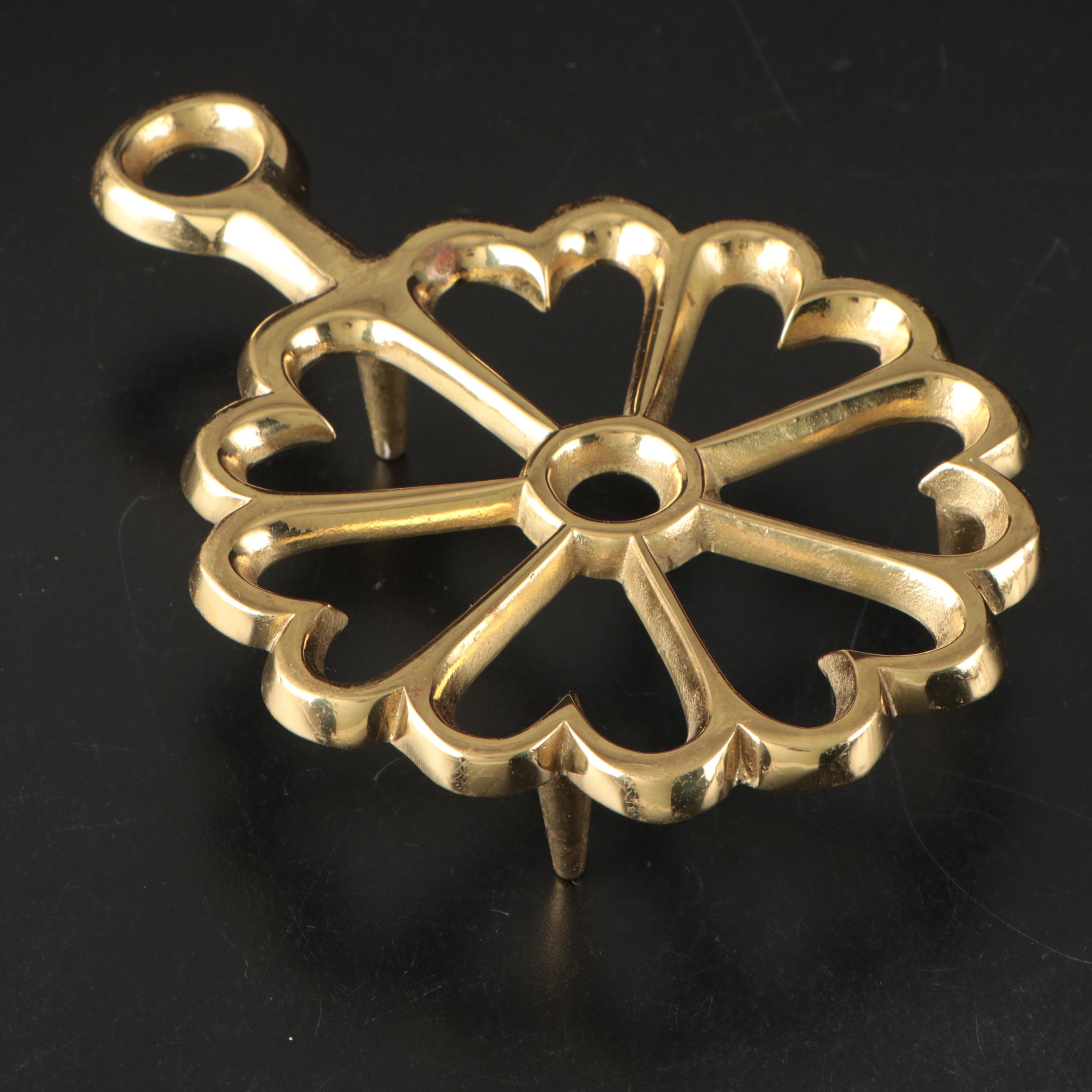 Virginia Metalcrafters "Kings Arms" with Other Brass Trivets and Candlesticks