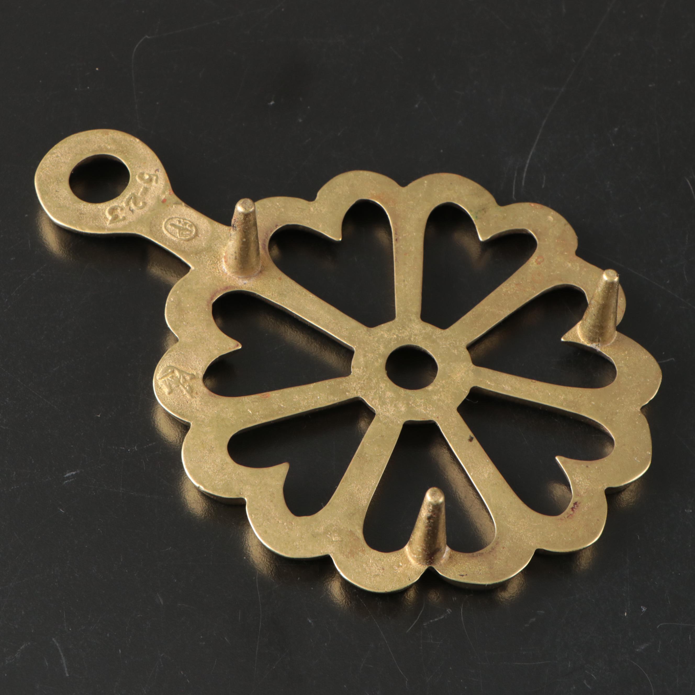 Virginia Metalcrafters "Kings Arms" with Other Brass Trivets and Candlesticks