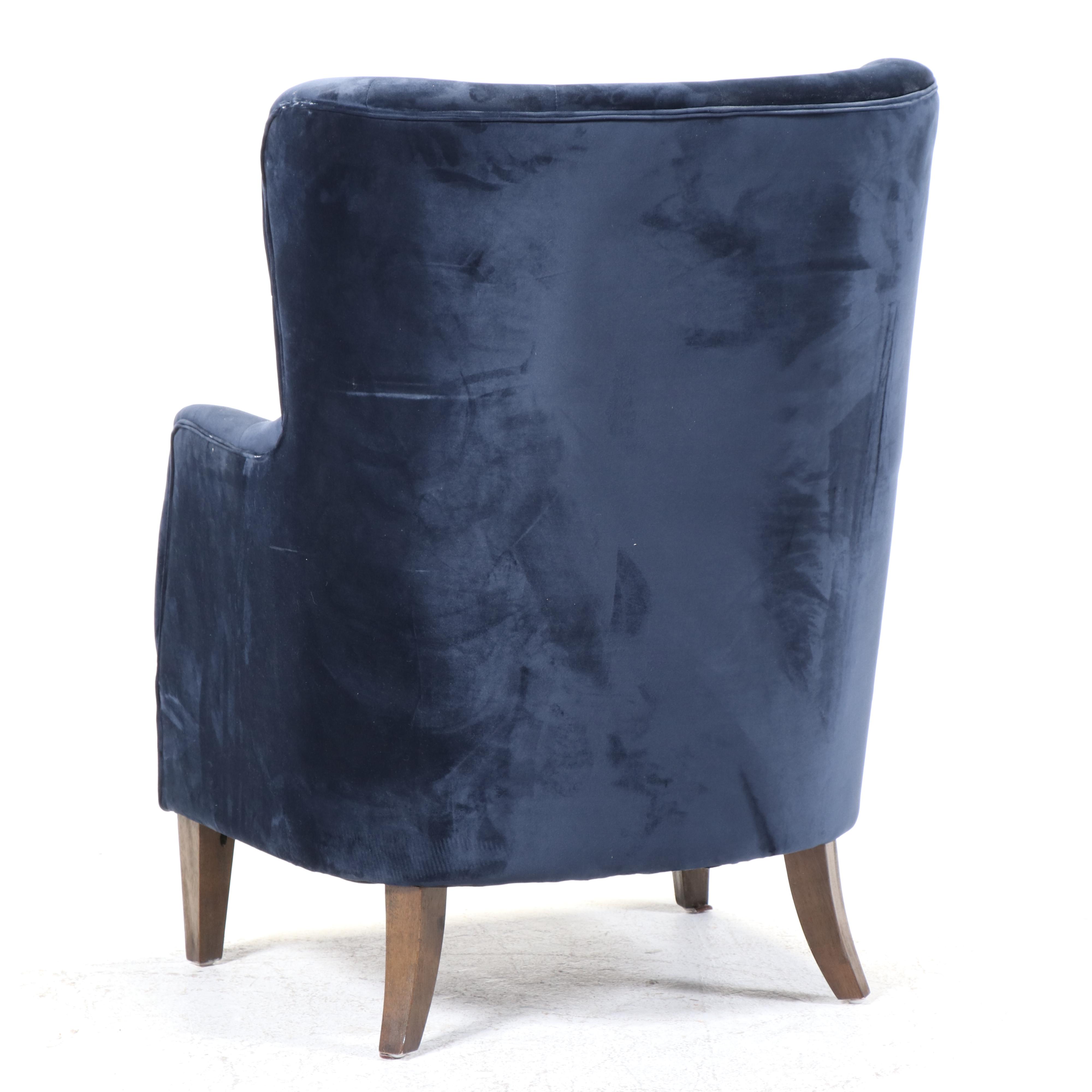 Classic Concepts Buttoned-Down Wing Chair Plus Patinated Metal Pharmacy Lamp