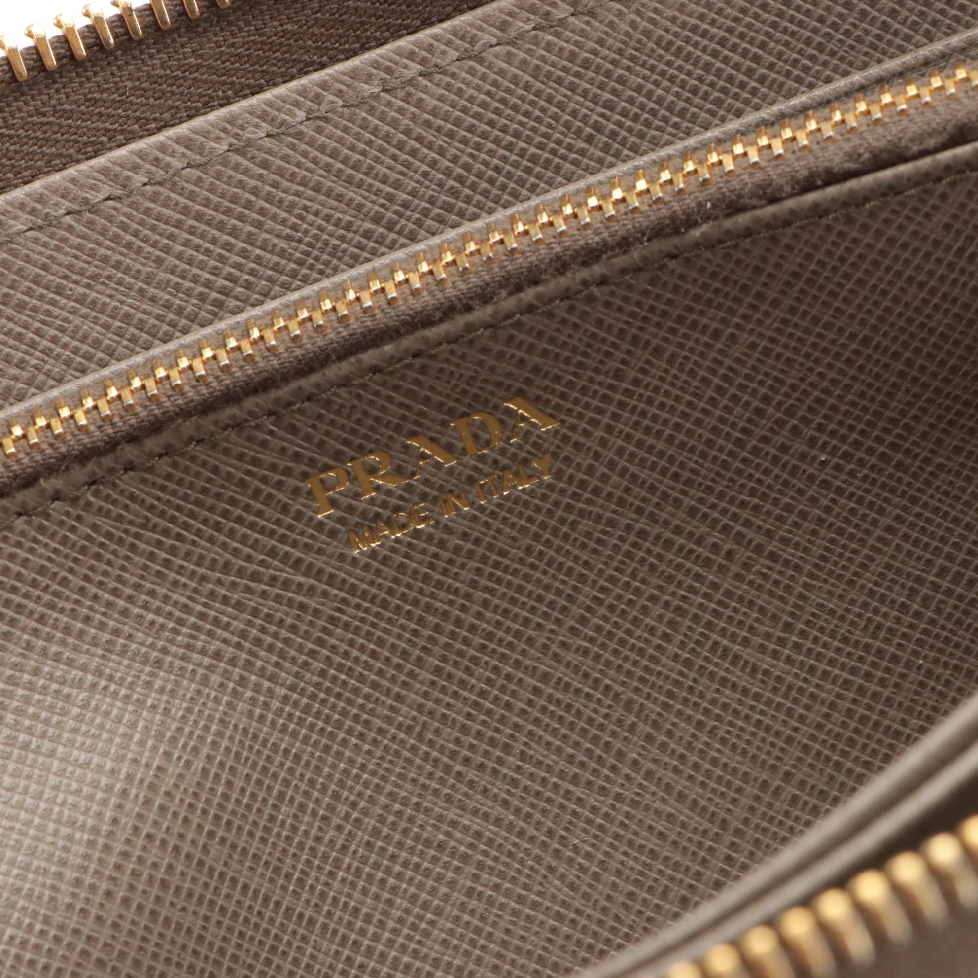 Prada Vera Bow Zip-Around Wallet in Argilla Saffiano Leather