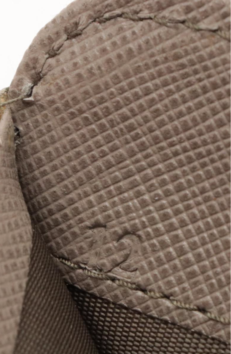 Prada Vera Bow Zip-Around Wallet in Argilla Saffiano Leather