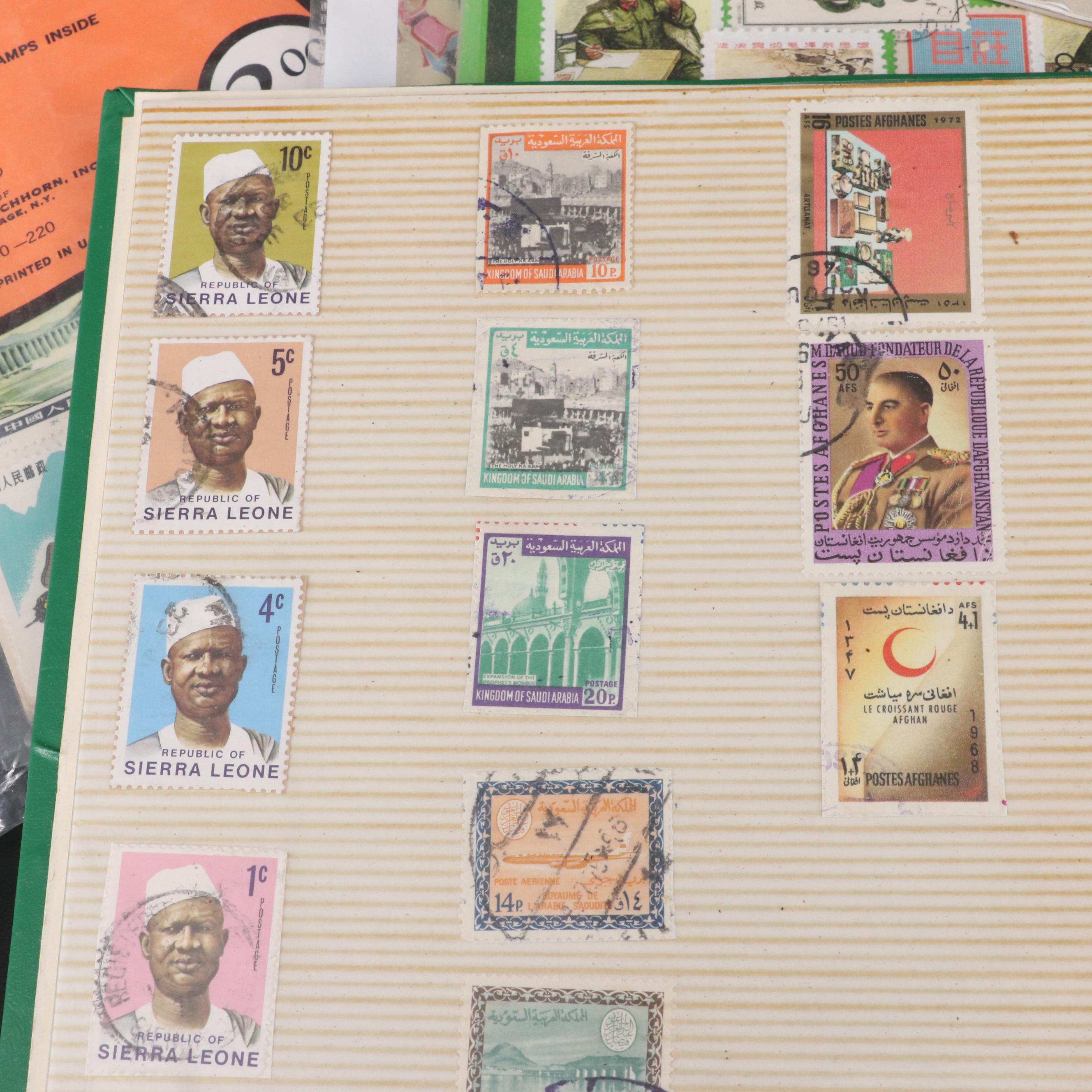 Two Chinese Postage Stamp Sets, an Album of World Stamps, and More