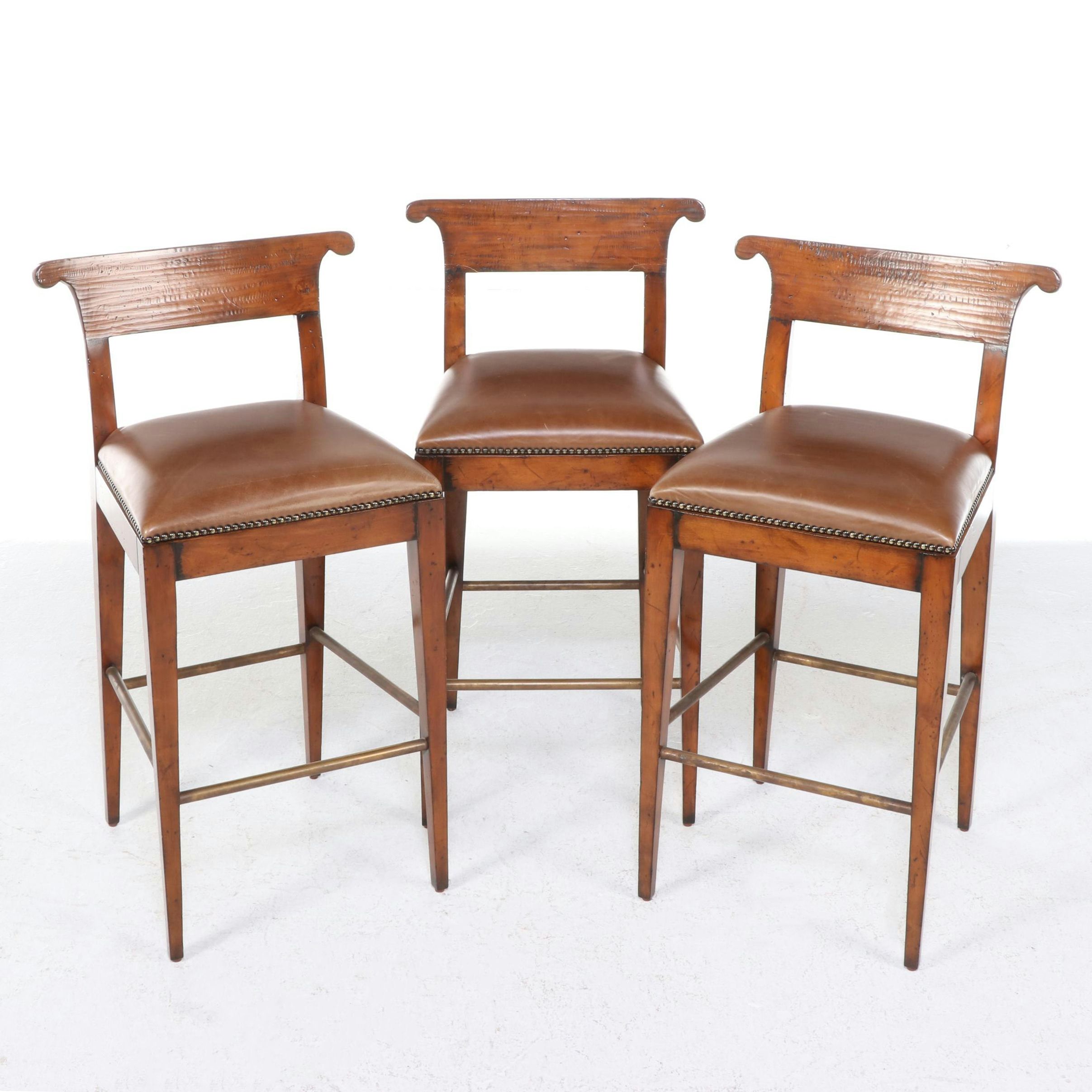 Three Henredon "Acquisitions" Brass-Mounted Fruitwood and Leather Bar Stools