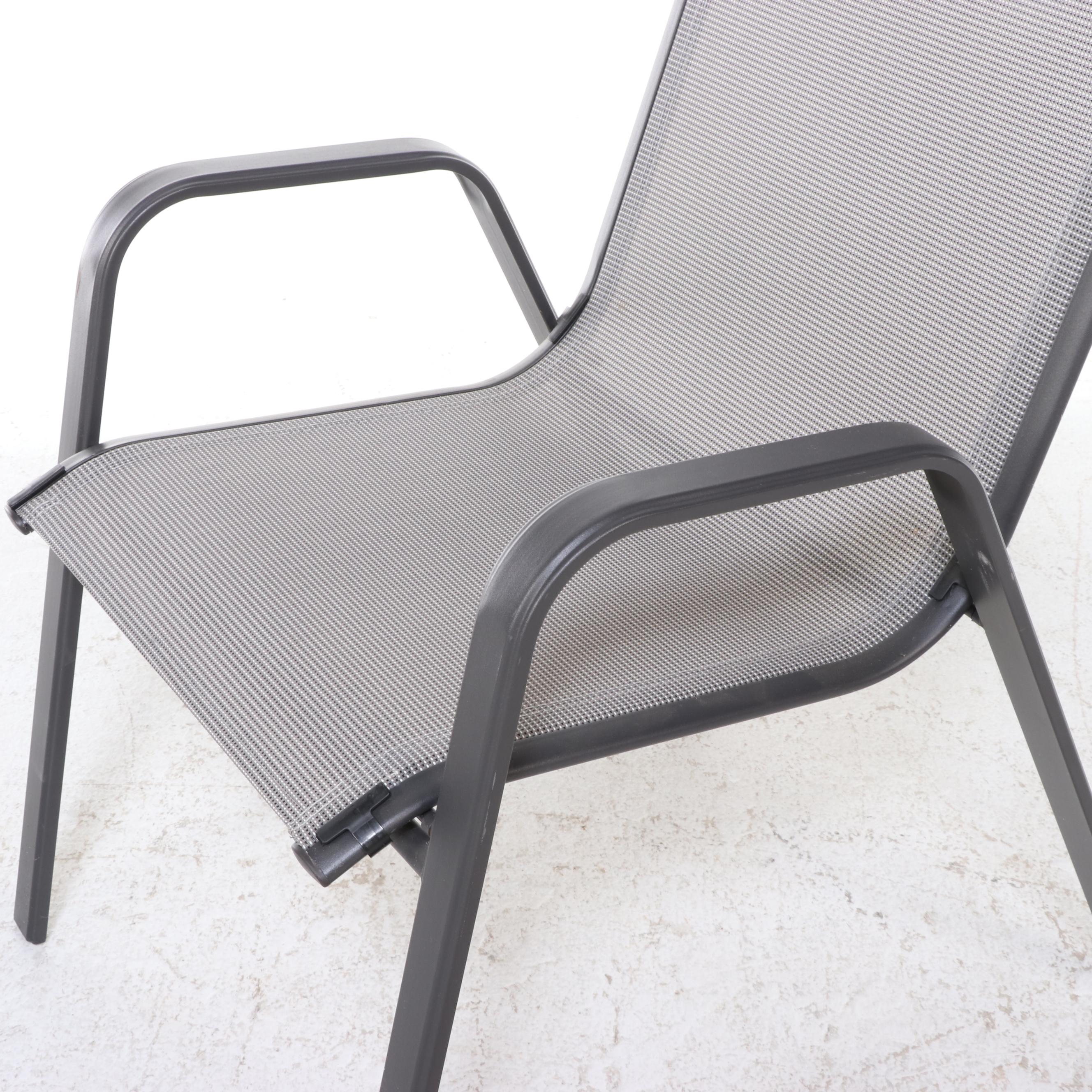 Two Cast Aluminum and Mesh Patio Chairs