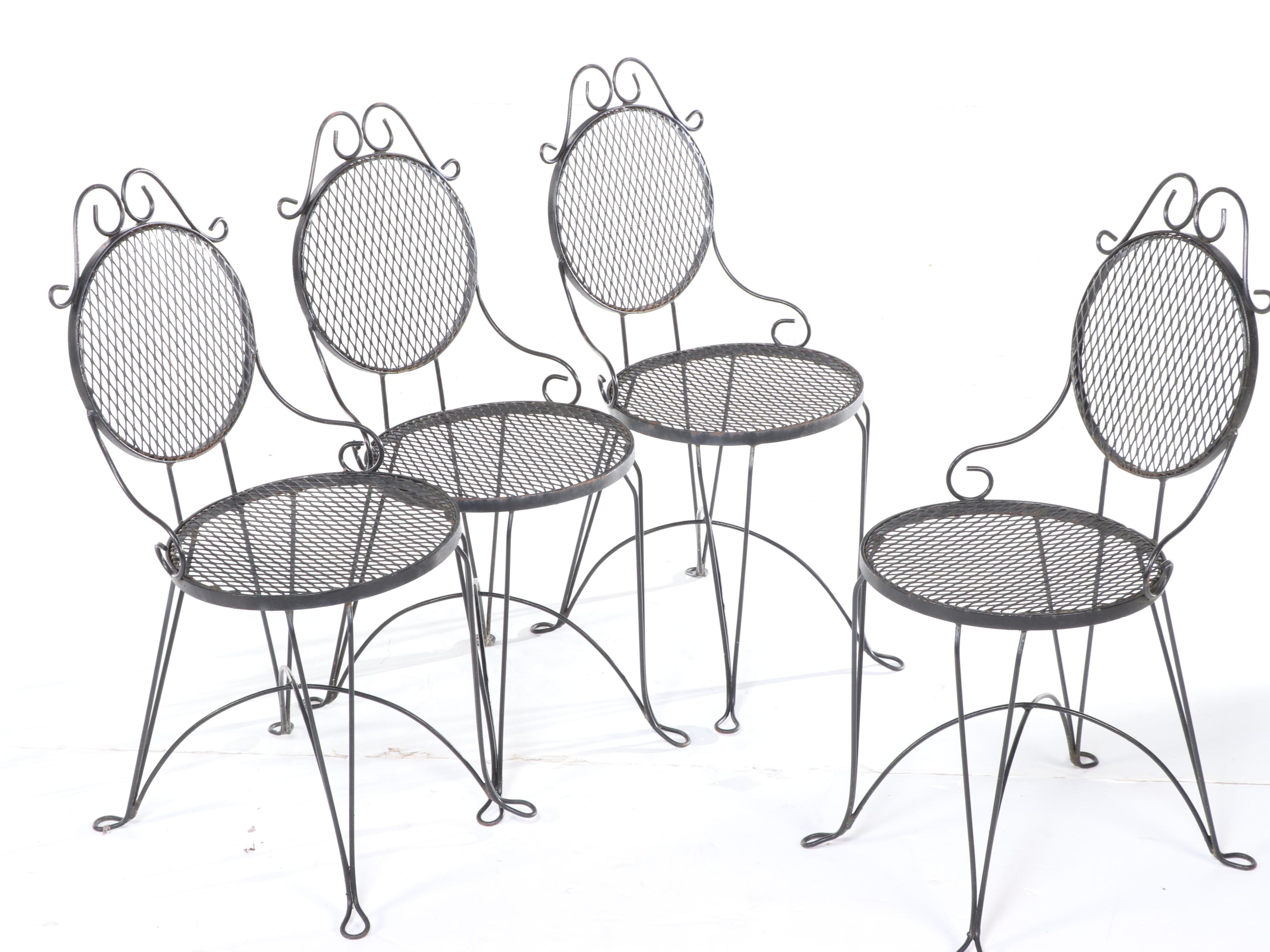 Four Wrought Iron Patio Dining Chairs and Table