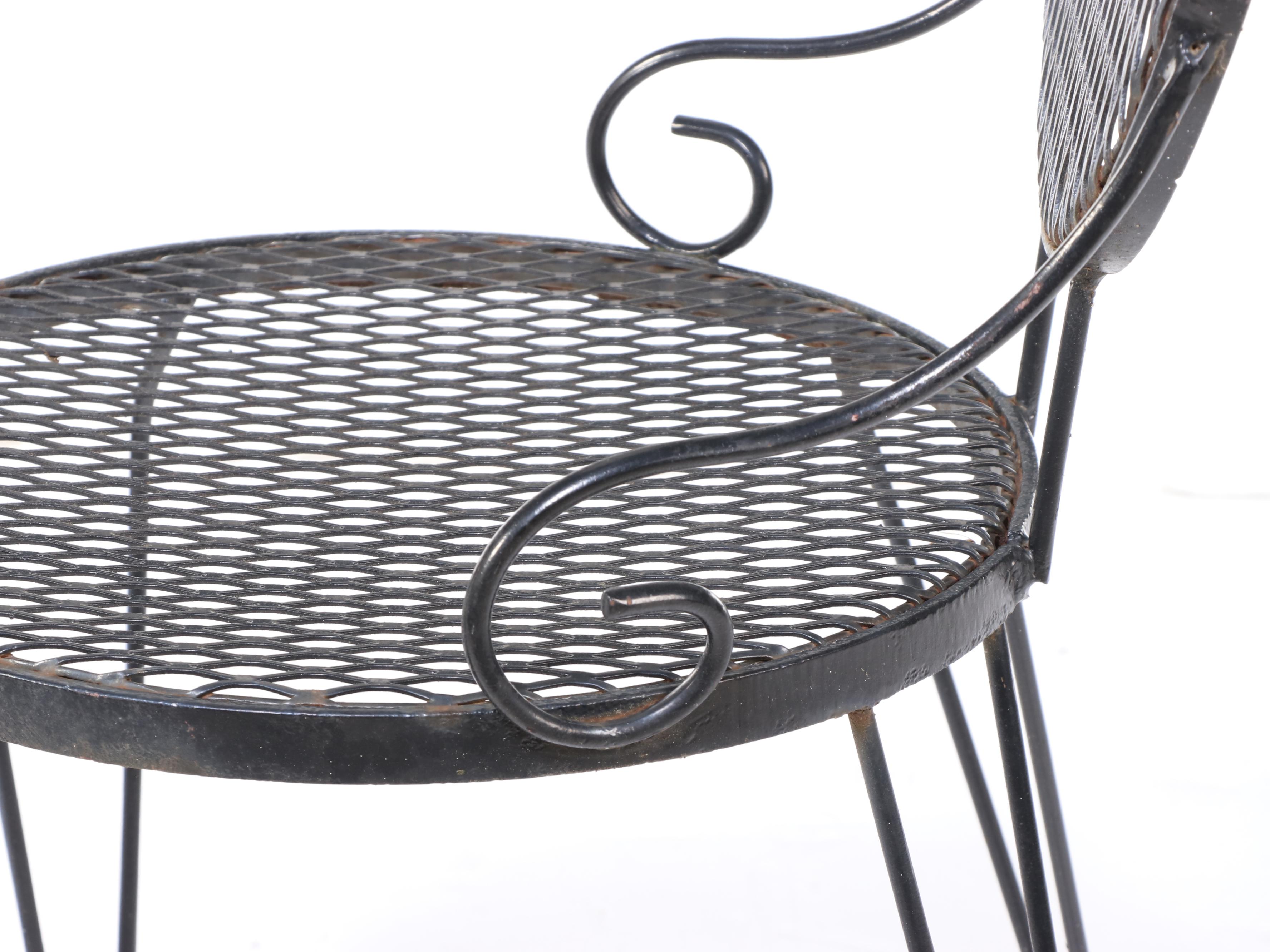 Four Wrought Iron Patio Dining Chairs and Table