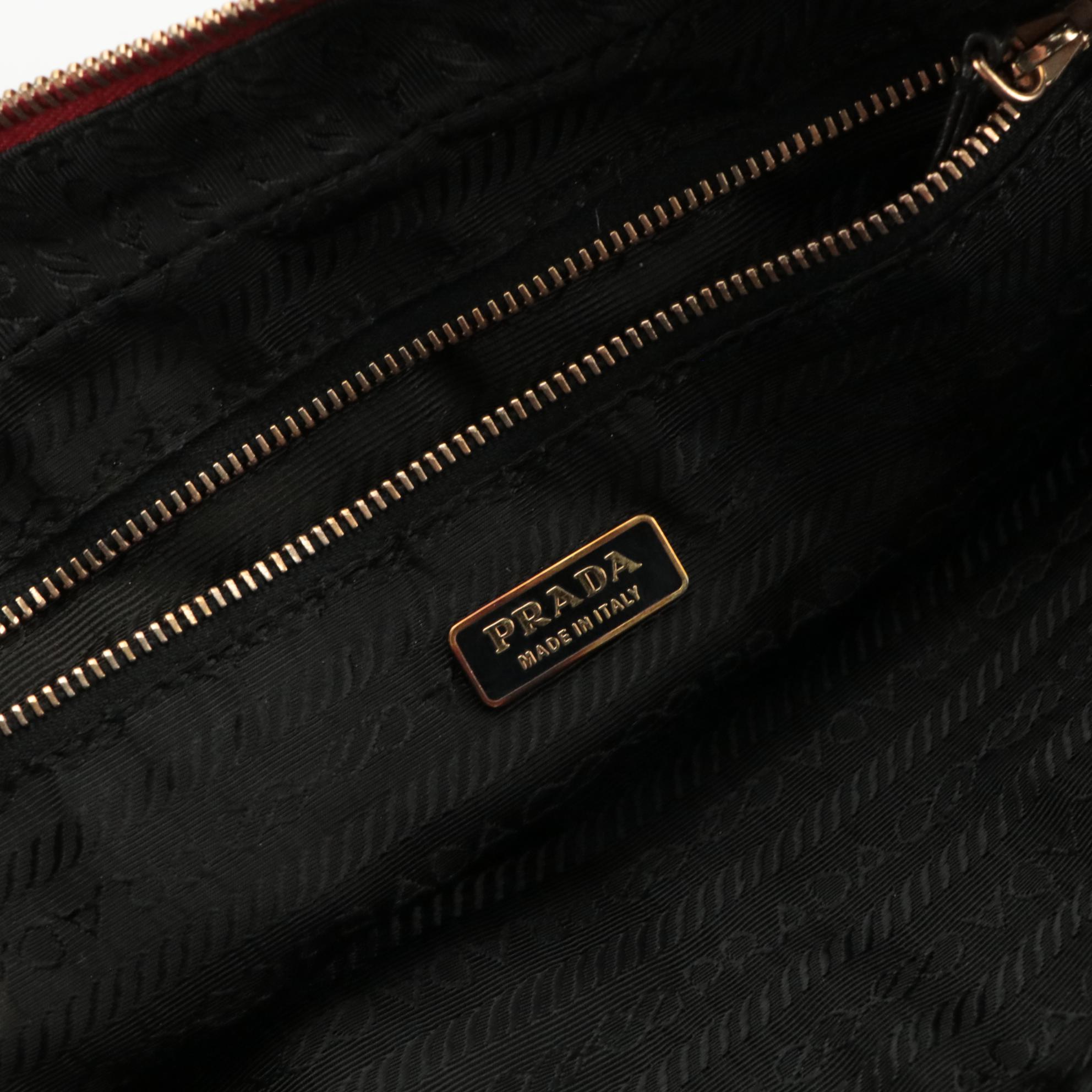 Prada Top Handle Grommet Bag in Red Leather