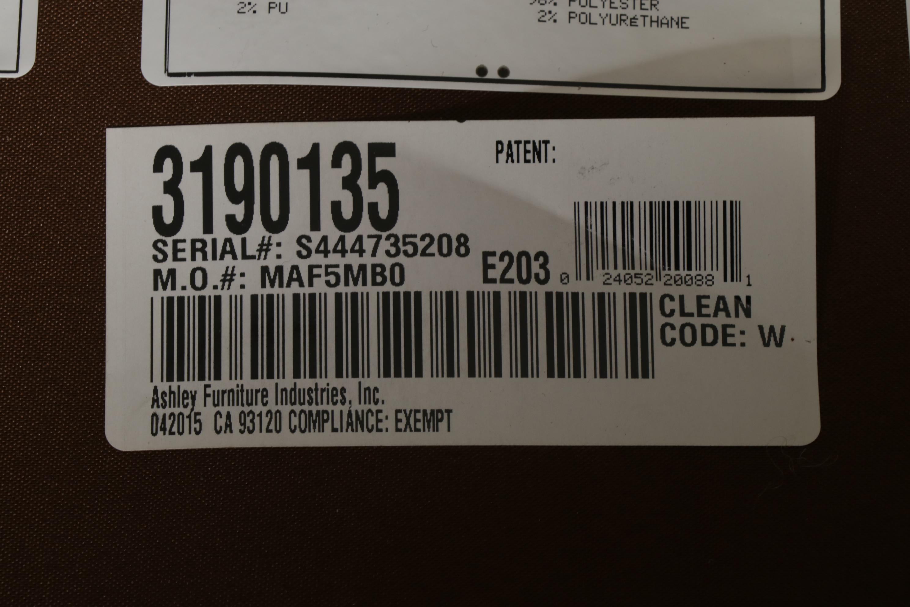 Ashley Furniture "Larkinhurst" Faux Leather Loveseat