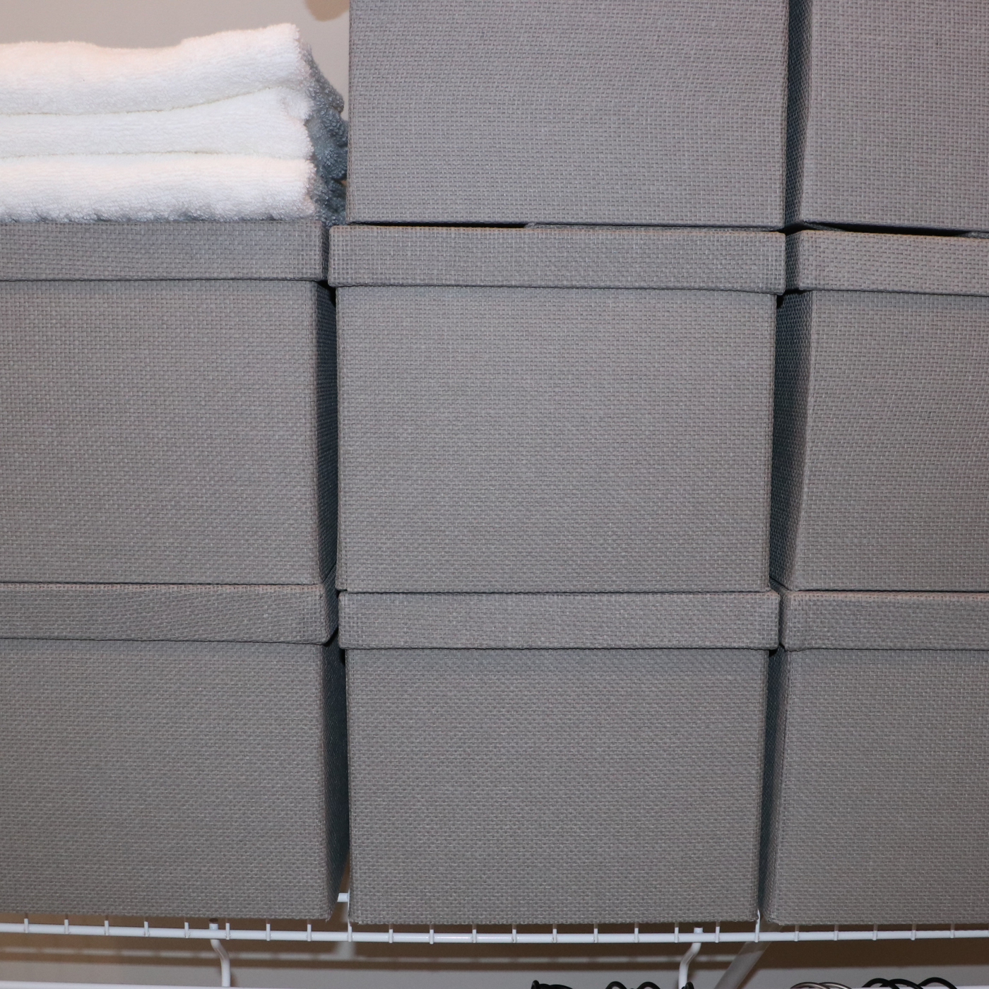 Grey Fabric Shoe Storage Cubes with Bath Linens and Clothes Hangers