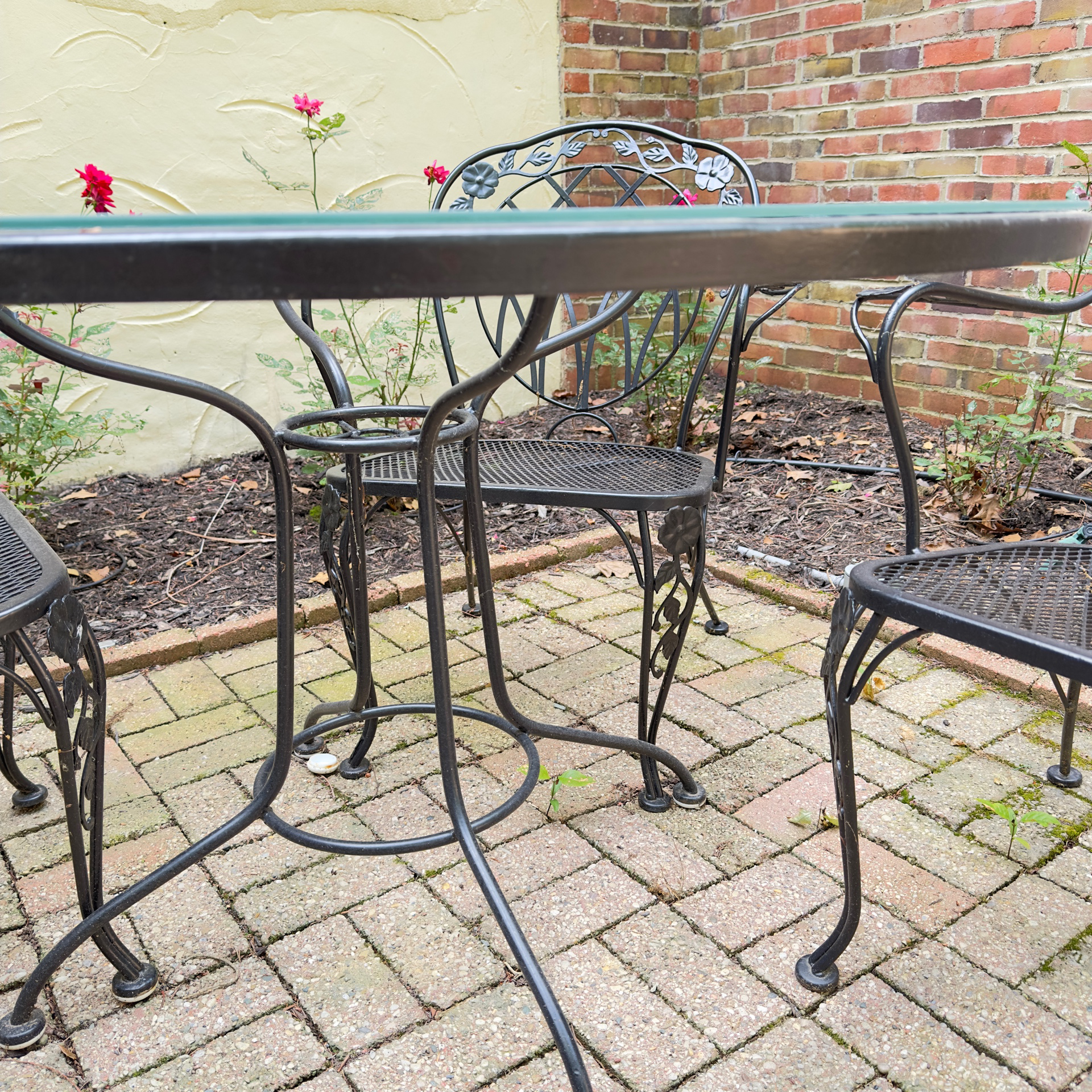 Glass-Top Patio Table and Four Openwork Floral Lattice Chairs