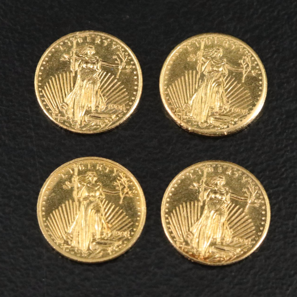 Four Miniature Saint-Gaudens Double Eagle Gold Replica Coins