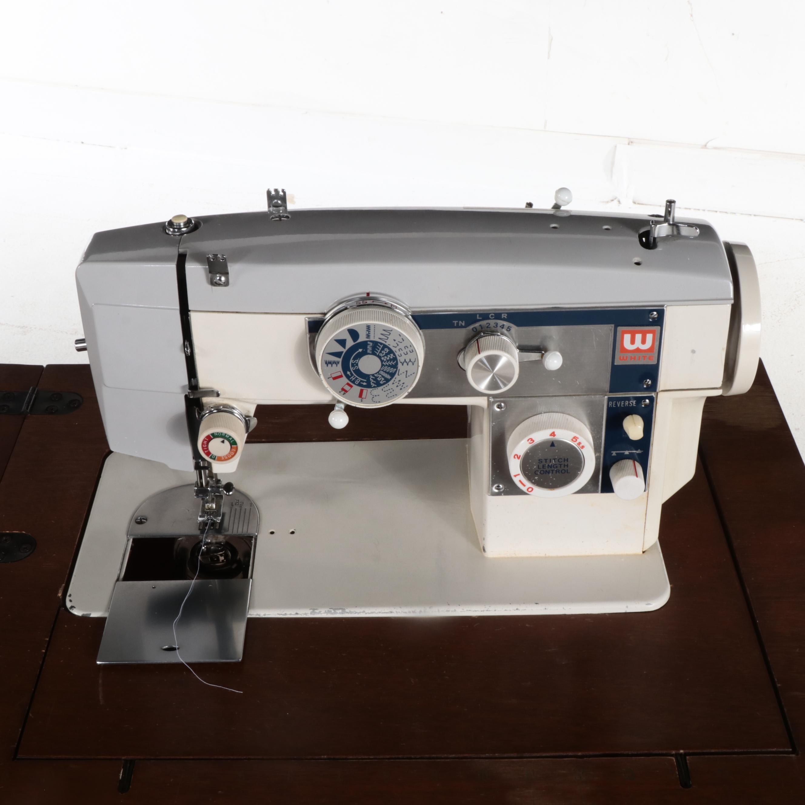 White Electric Sewing Machine in a Mahogany Table with Oak Chair