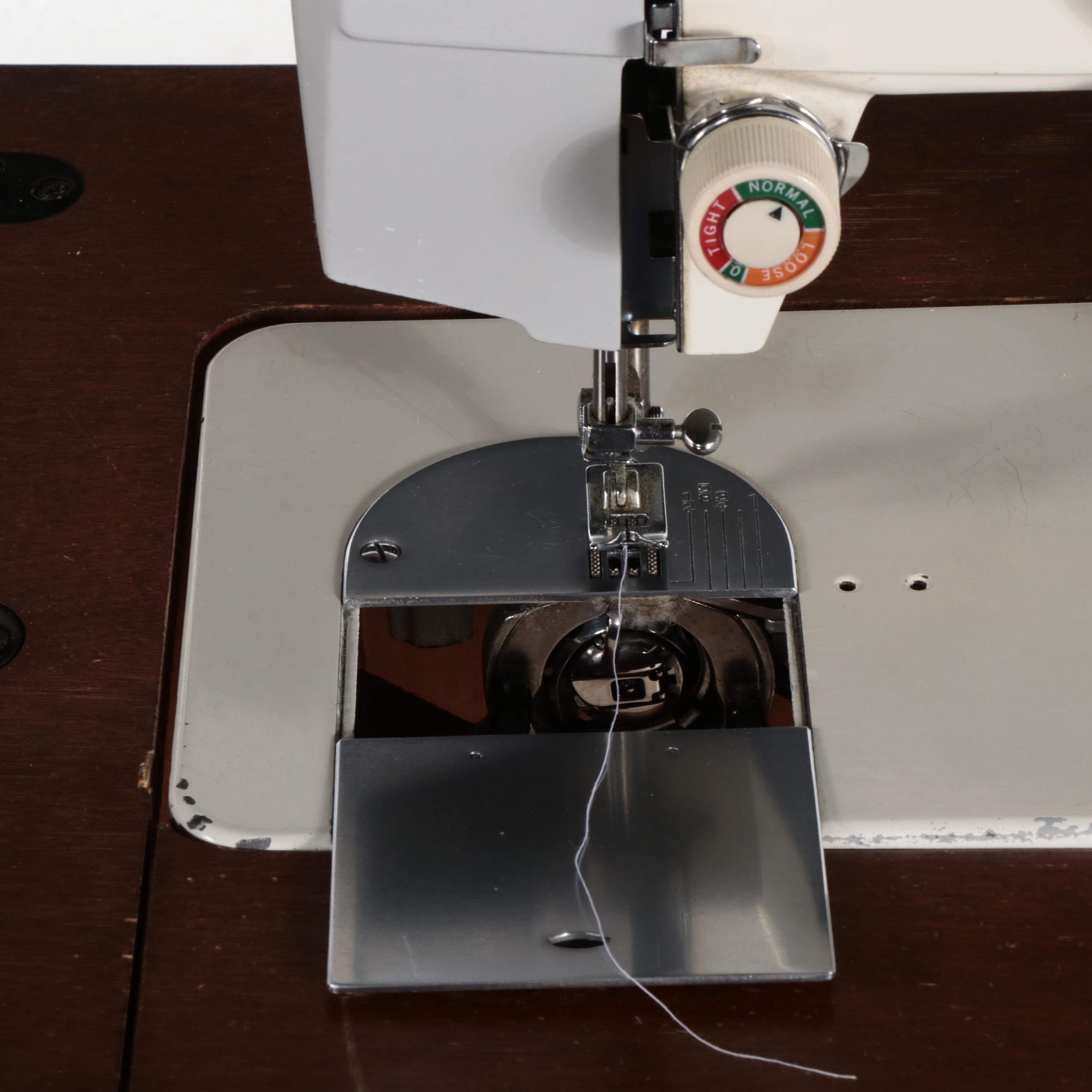 White Electric Sewing Machine in a Mahogany Table with Oak Chair