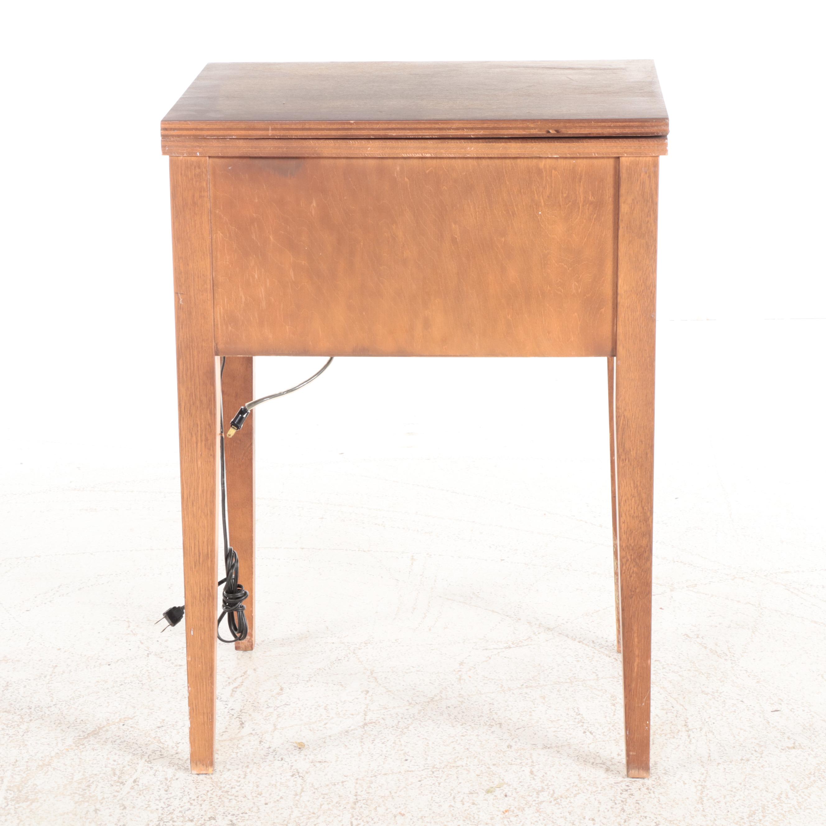 White Electric Sewing Machine in a Mahogany Table with Oak Chair