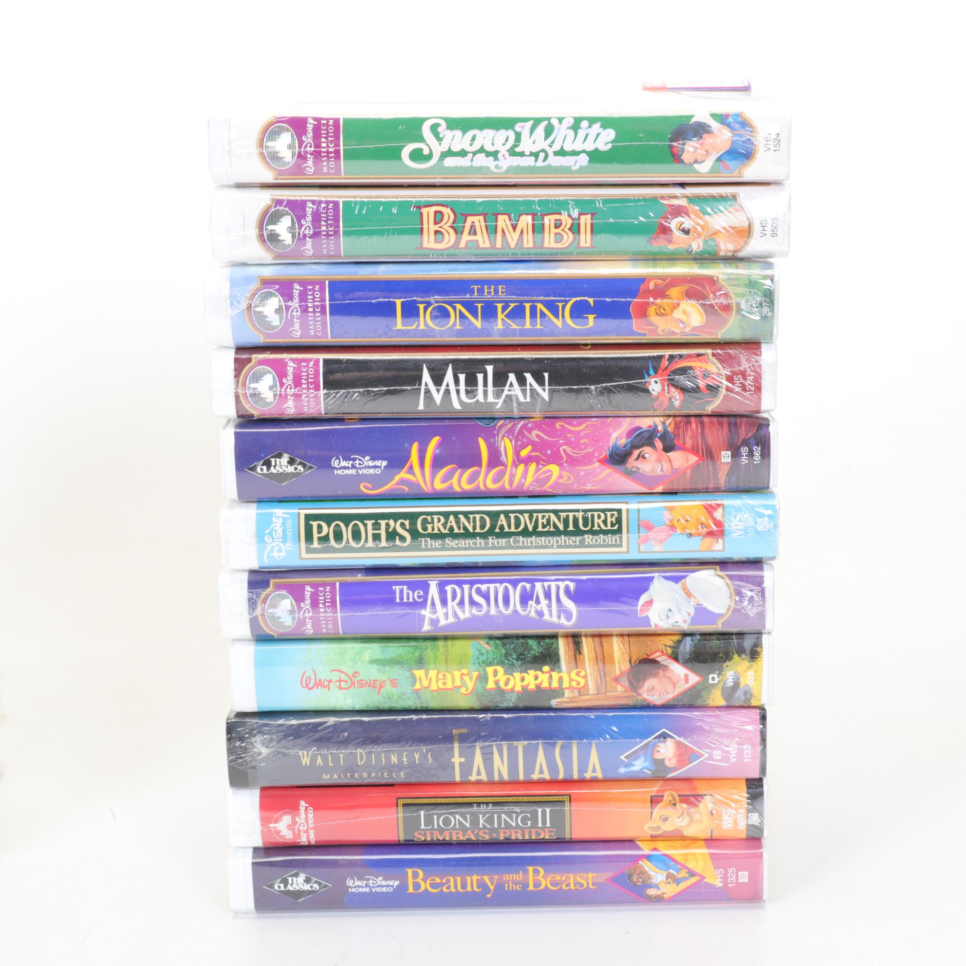 Walt Disney Ornaments and Classic VHS Tapes Including "Bambi" and "Snow White"