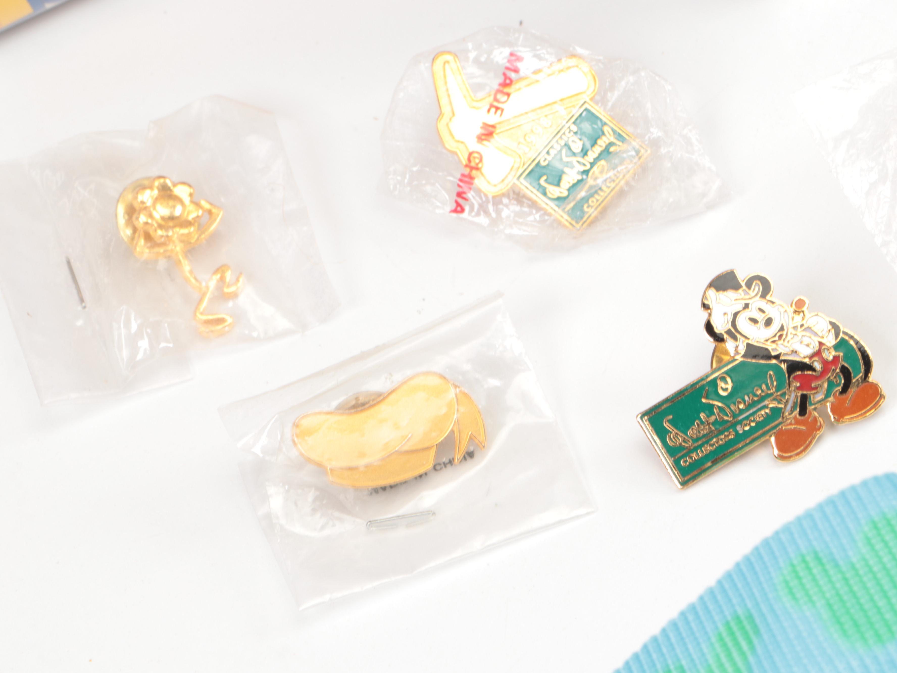 Disney Classics VHS Tapes, Disney Pins, and "Pooh Pals'' Mini Ornaments