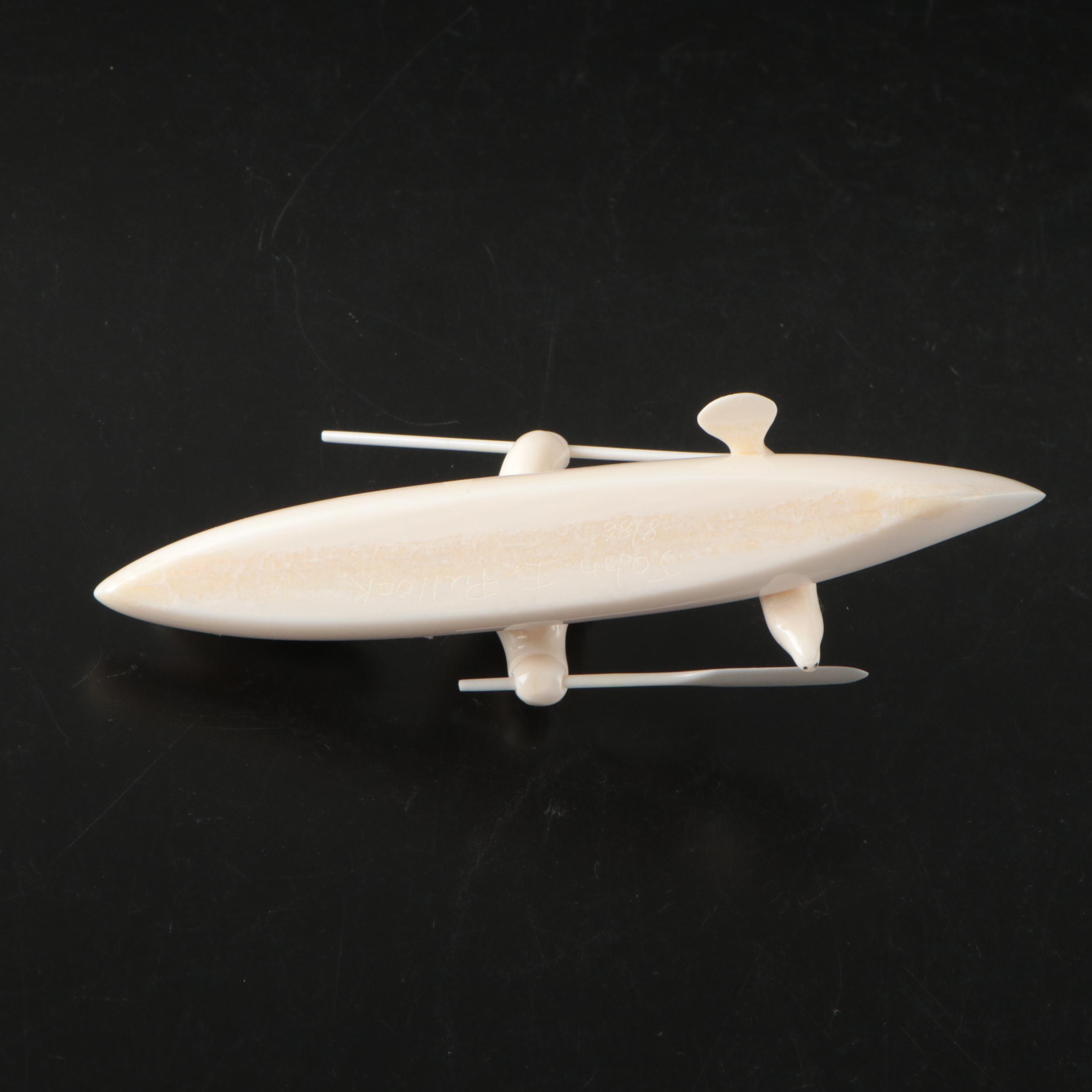 John Pullock Native Alaskan Carved Walrus Tusk Figure of Seal Hunter in Kayak