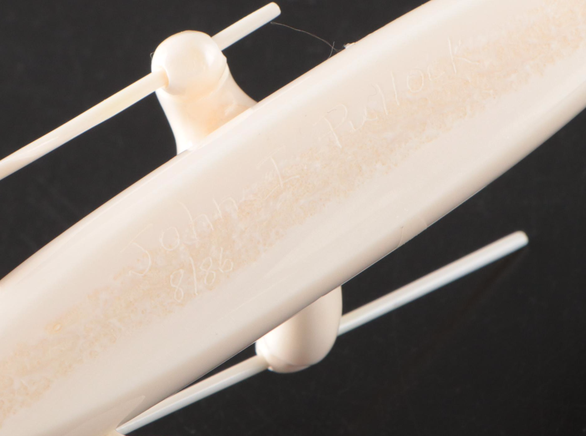 John Pullock Native Alaskan Carved Walrus Tusk Figure of Seal Hunter in Kayak