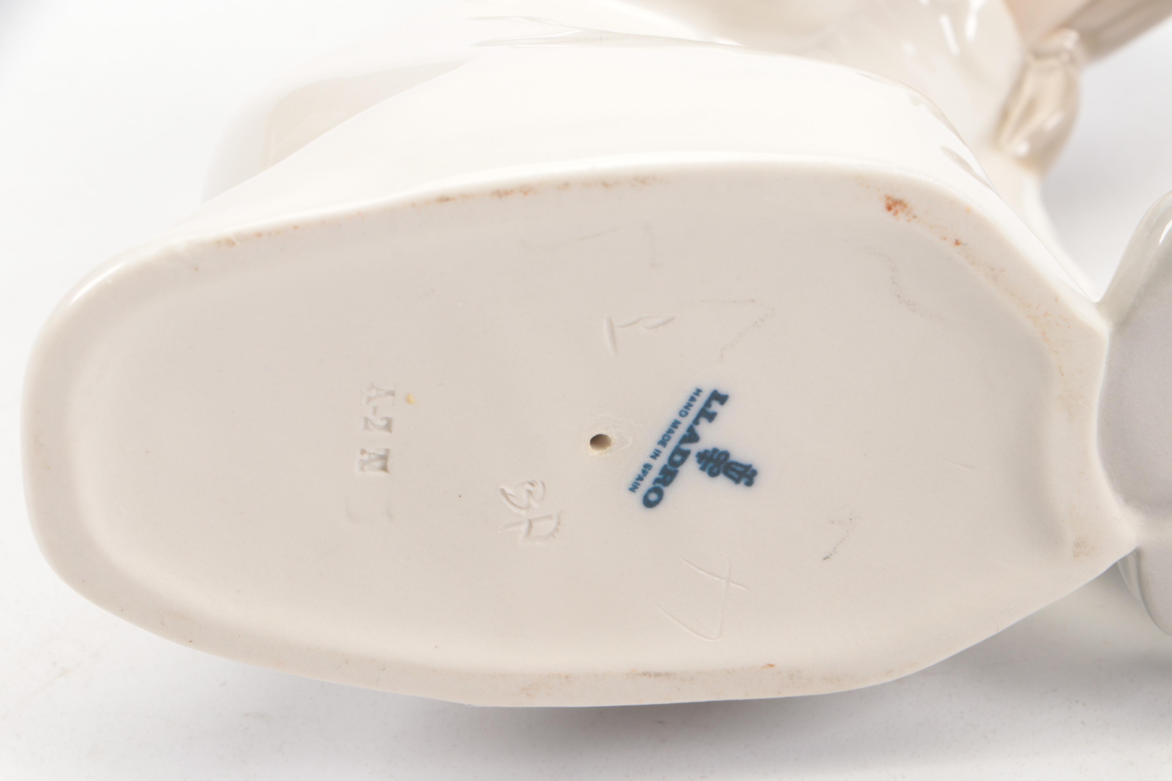 Lladró "Little Boy Thinker" and "Girl with Slippers" Porcelain Figurines