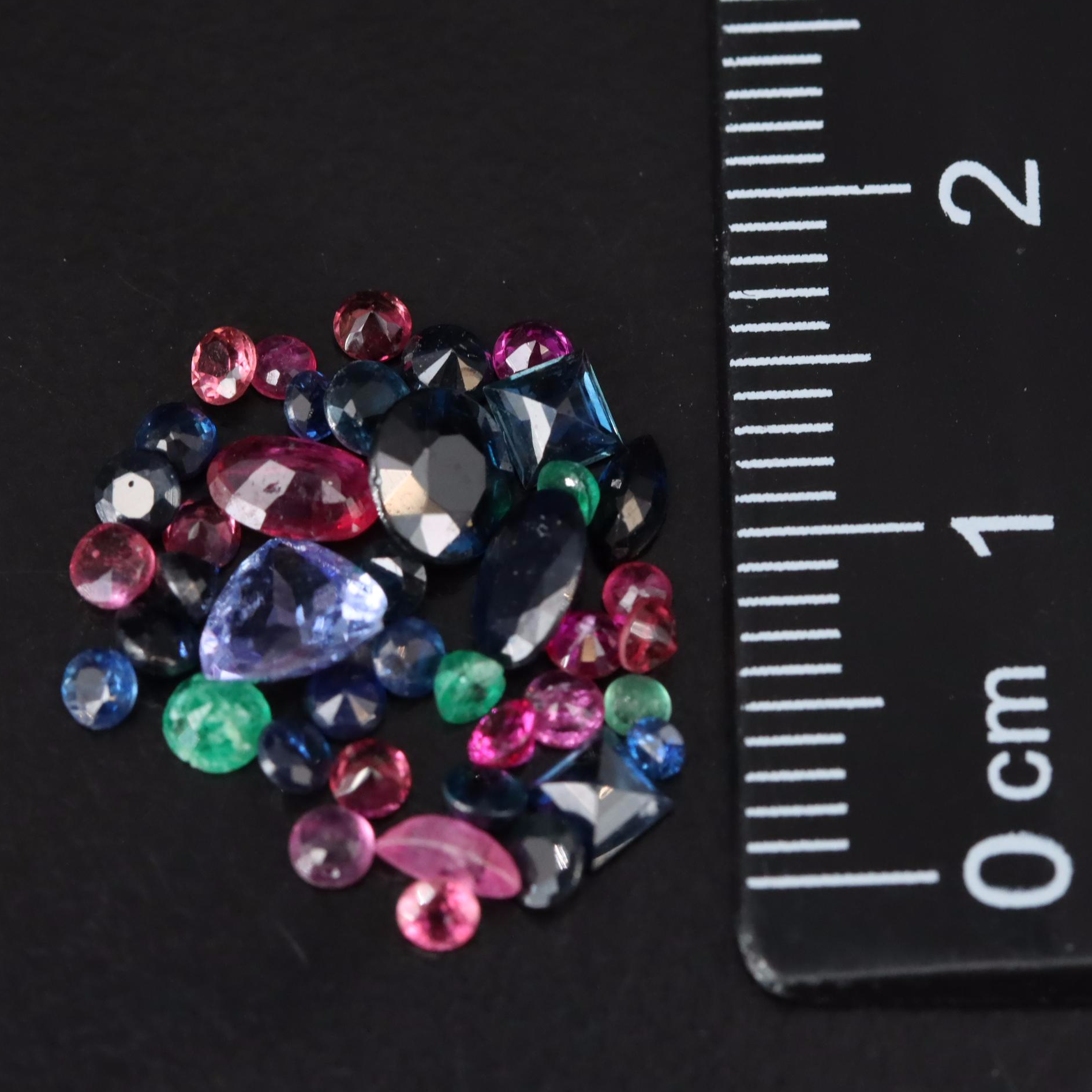 Loose 3.69 CTW Mixed Gemstones Including Emerald, Sapphire and Tanzanite