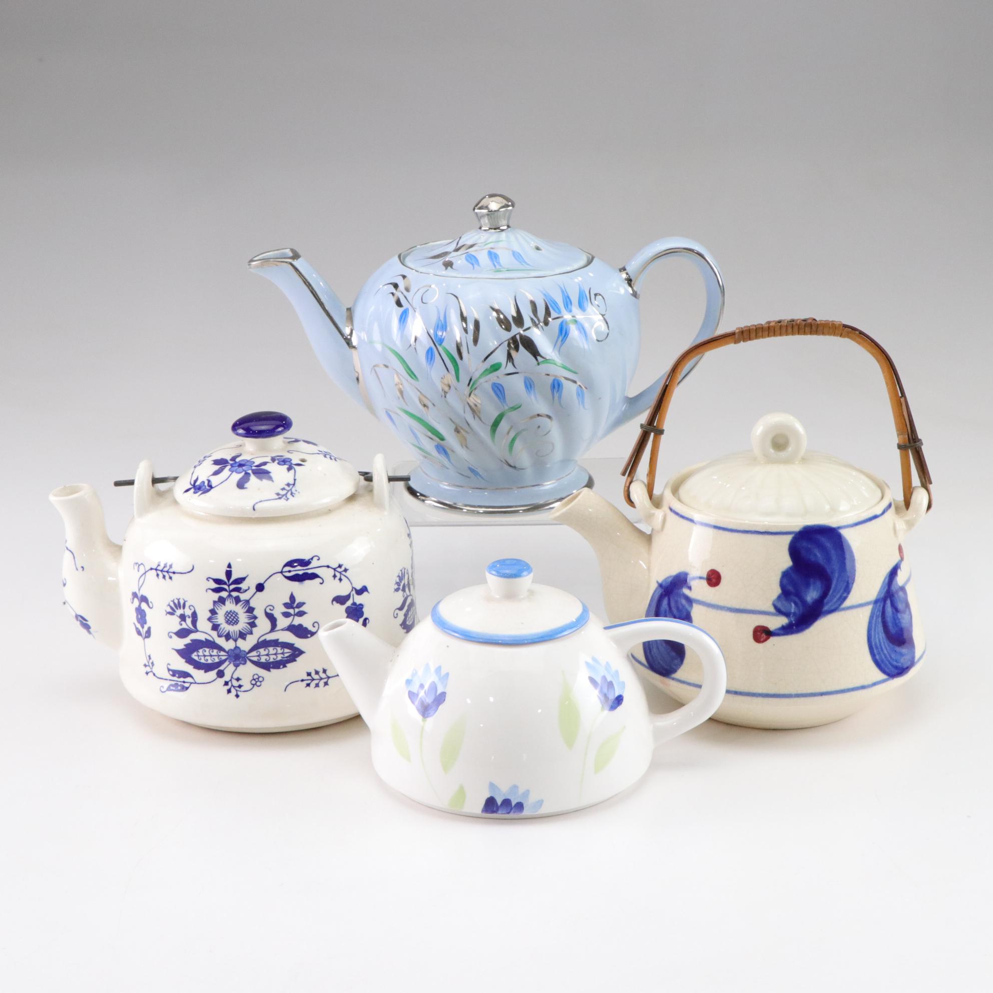 Sadler Light Blue Ceramic Teapot with Chrome Accents with Three Other Teapots