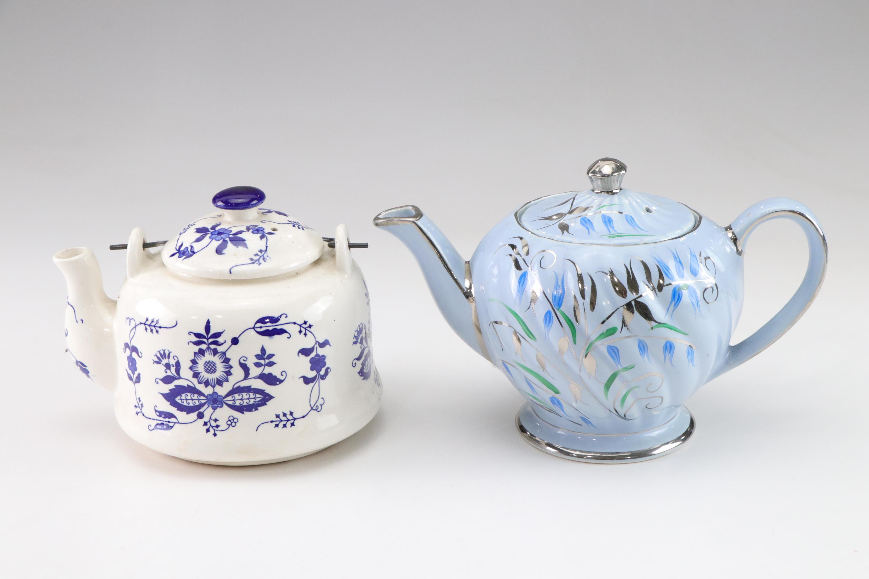 Sadler Light Blue Ceramic Teapot with Chrome Accents with Three Other Teapots