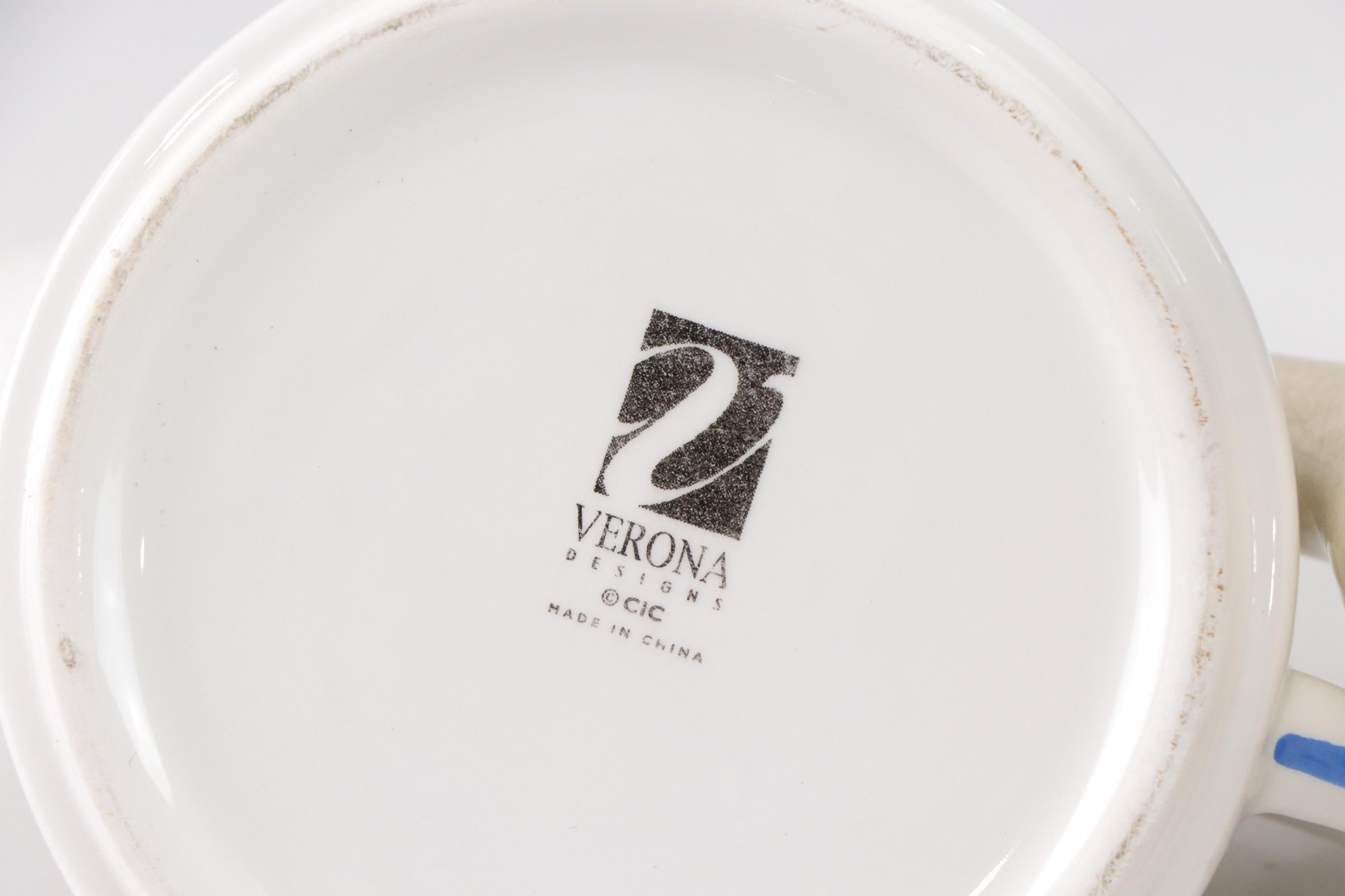 Sadler Light Blue Ceramic Teapot with Chrome Accents with Three Other Teapots