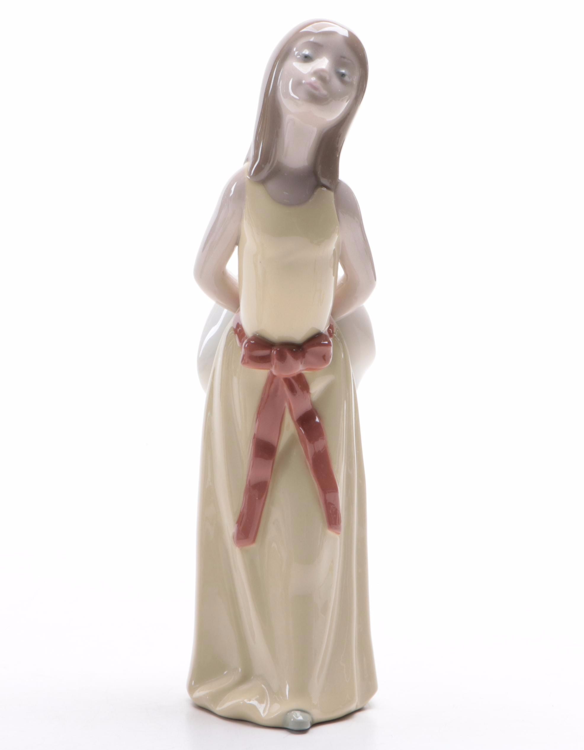 Lladró "Girl with Umbrella" and "Naughty Girl with Straw Hat" Figurines