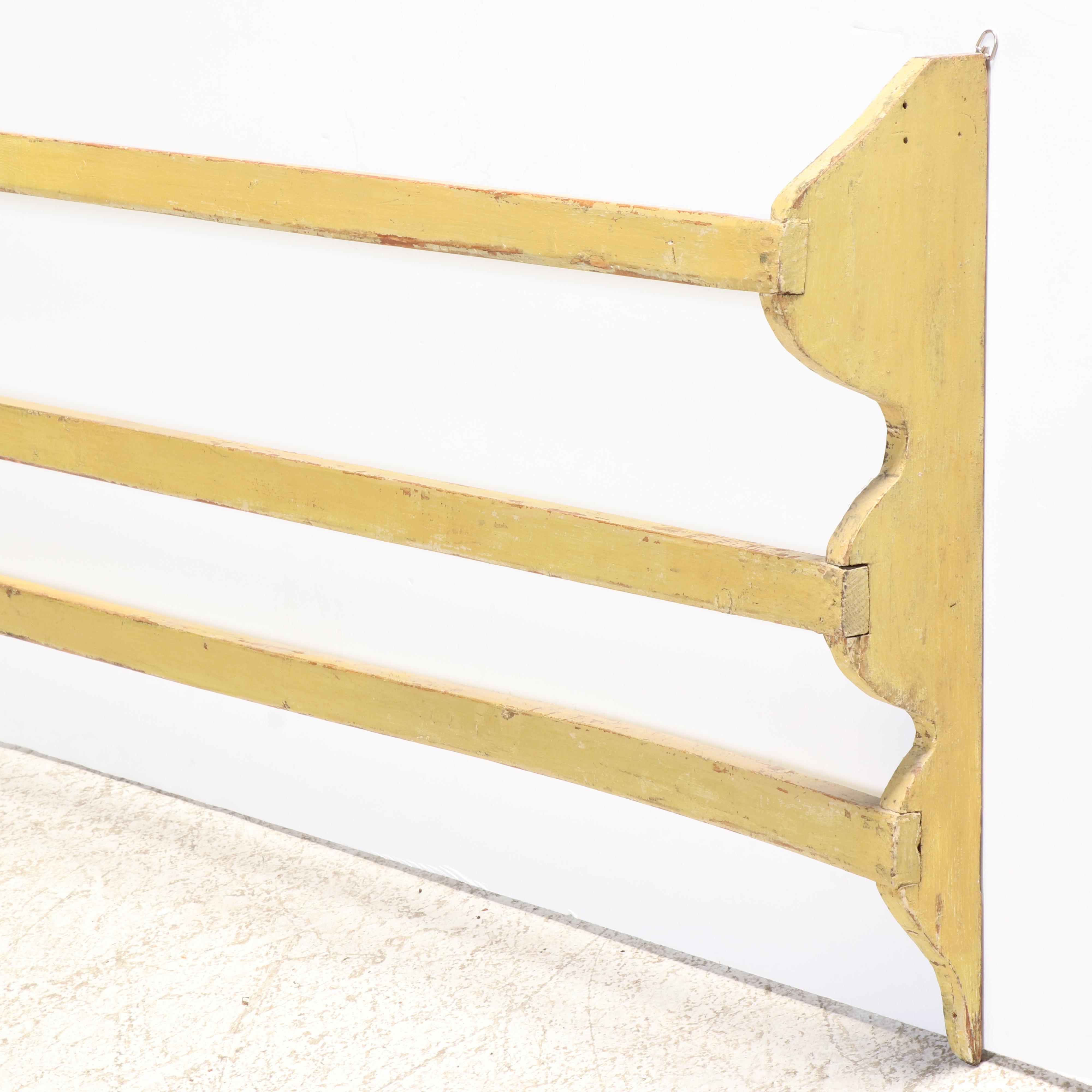 Large American Primitive Yellow-Painted Pine Three-Tier Wall-Mounted Quilt Rack