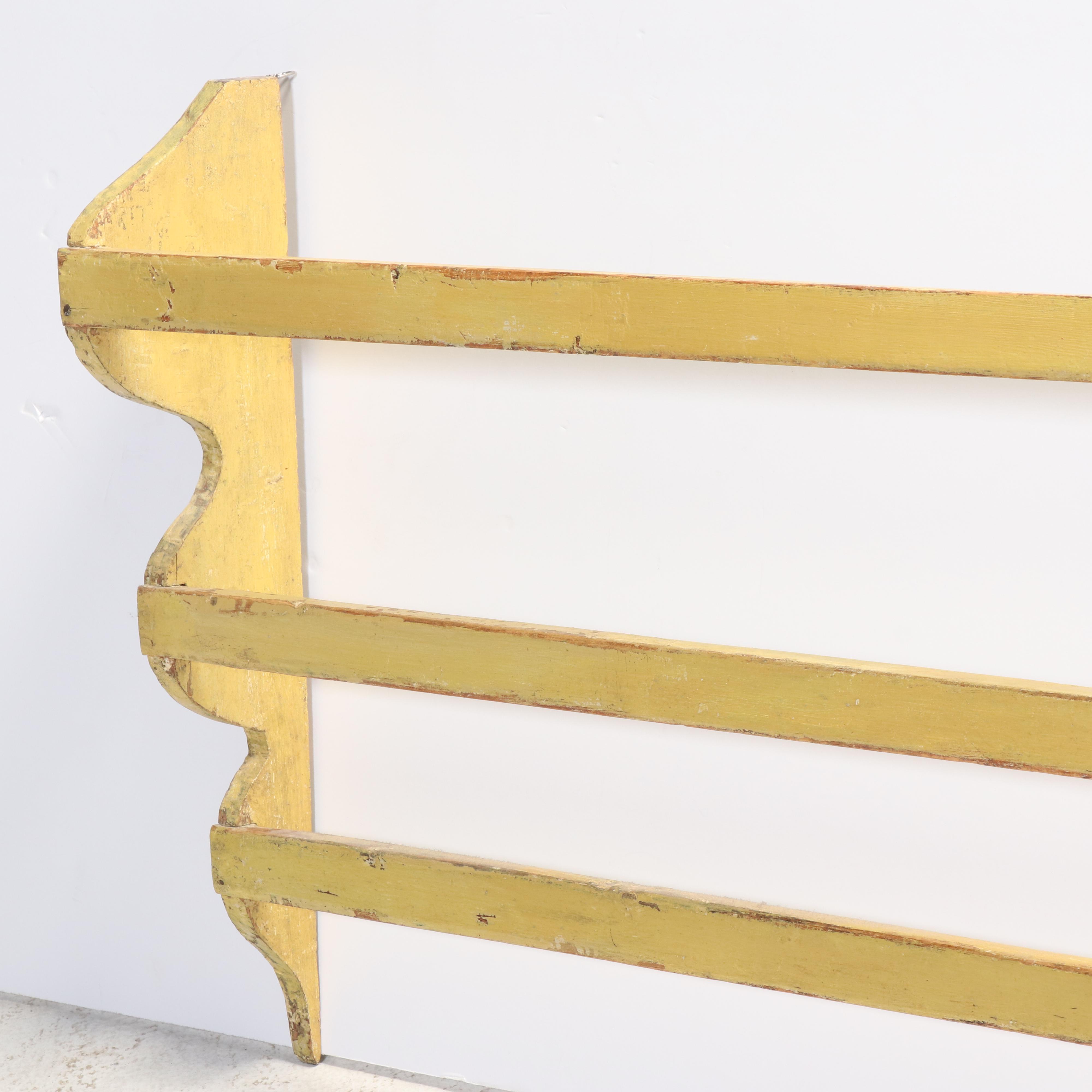 Large American Primitive Yellow-Painted Pine Three-Tier Wall-Mounted Quilt Rack