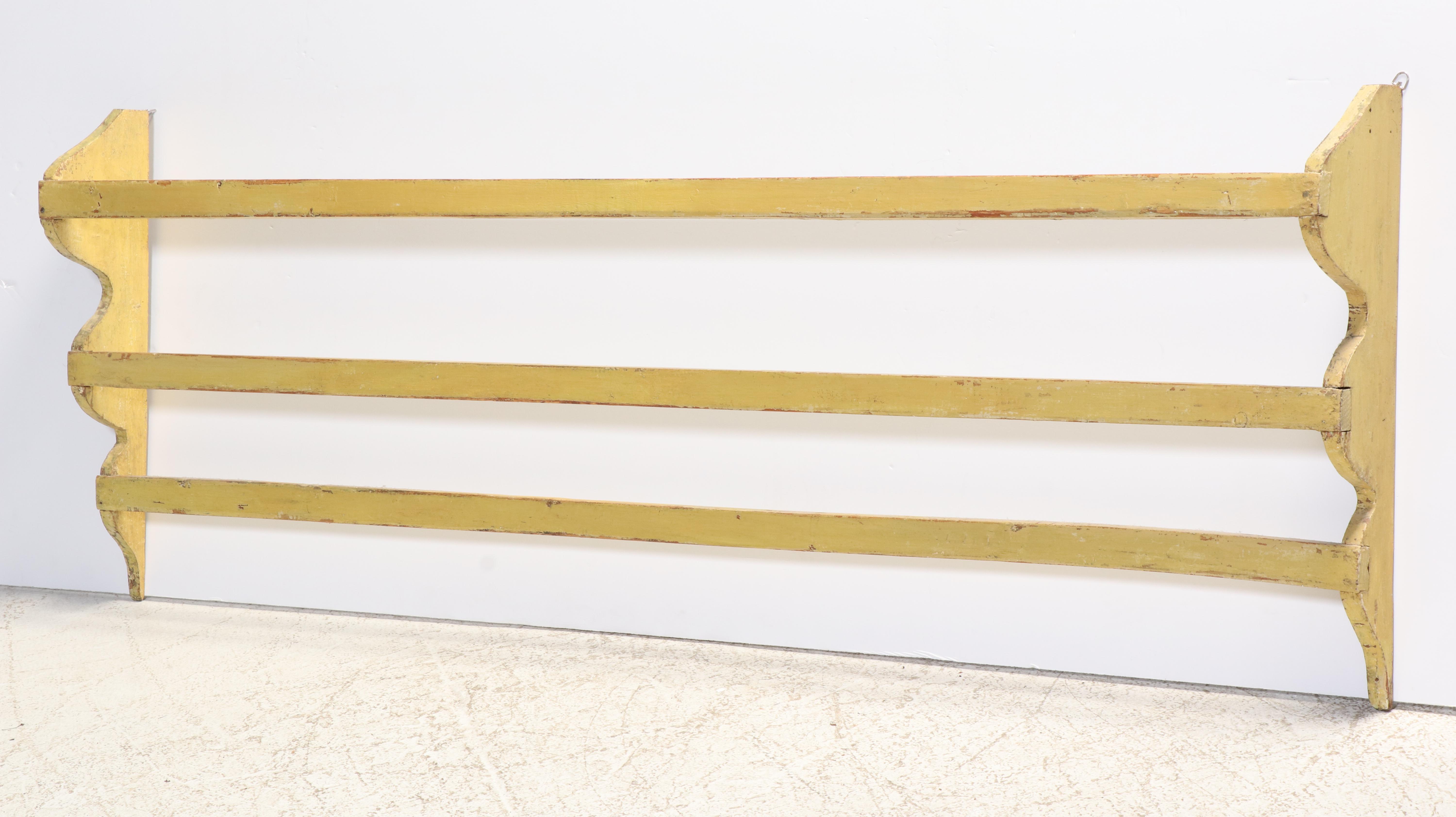 Large American Primitive Yellow-Painted Pine Three-Tier Wall-Mounted Quilt Rack