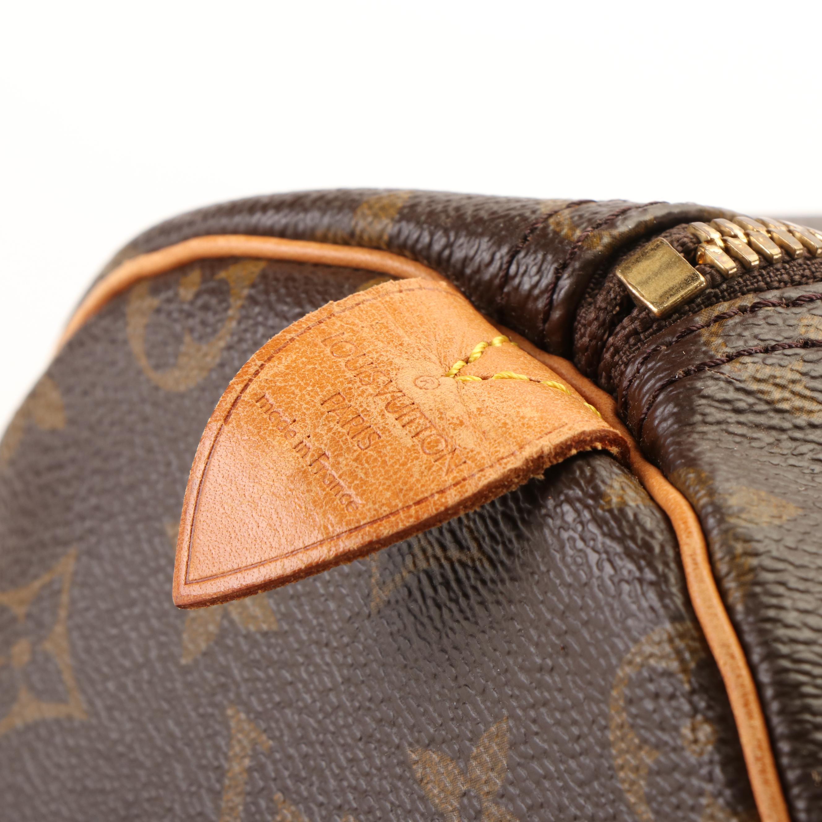 Louis Vuitton Keepall 55 Travel Bag in Monogram Canvas and Leather