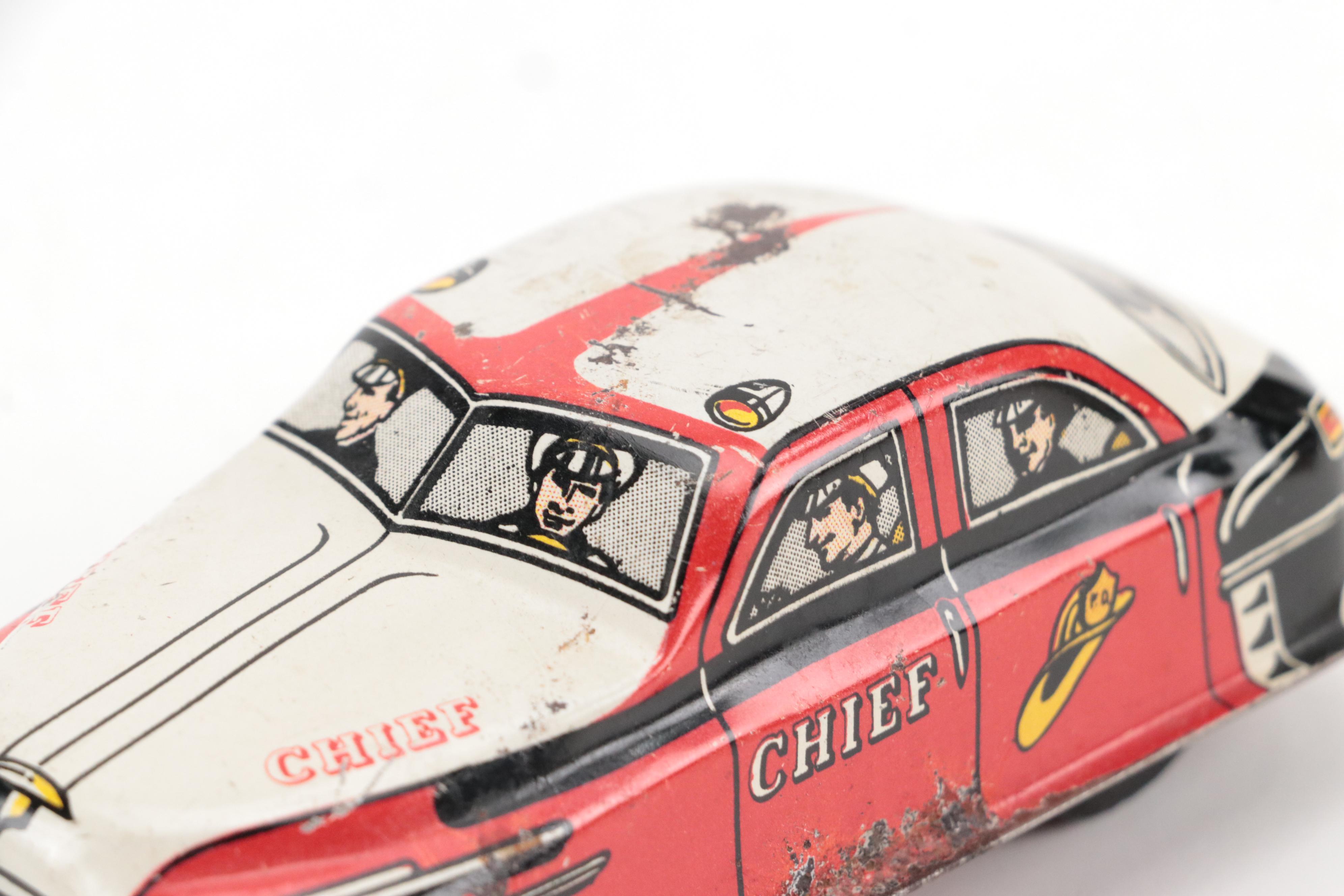 Lupor Tin Litho Perpetual Motion Police Chief Car with Other Tin Litho Cars