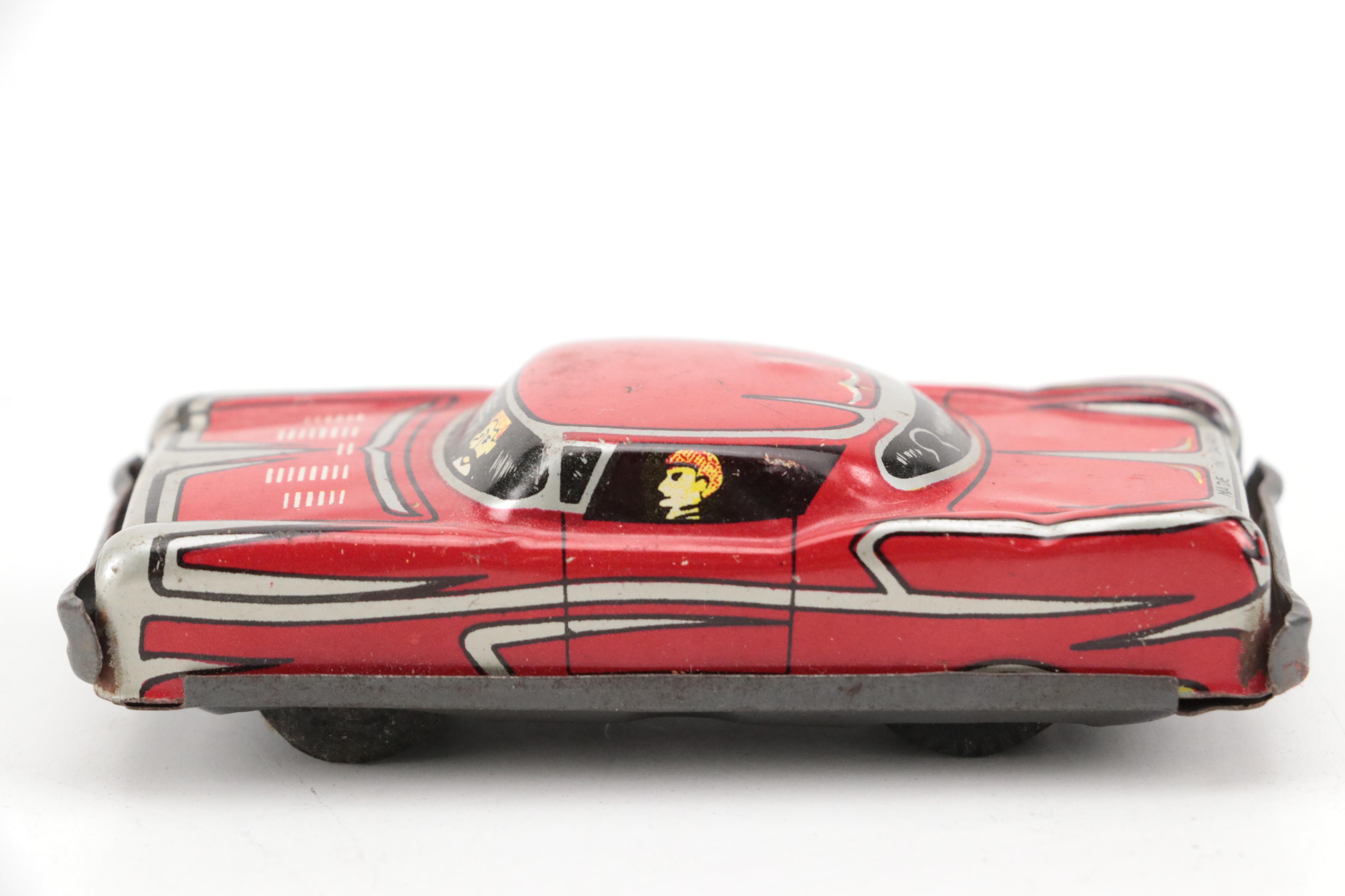 Lupor Tin Litho Perpetual Motion Police Chief Car with Other Tin Litho Cars