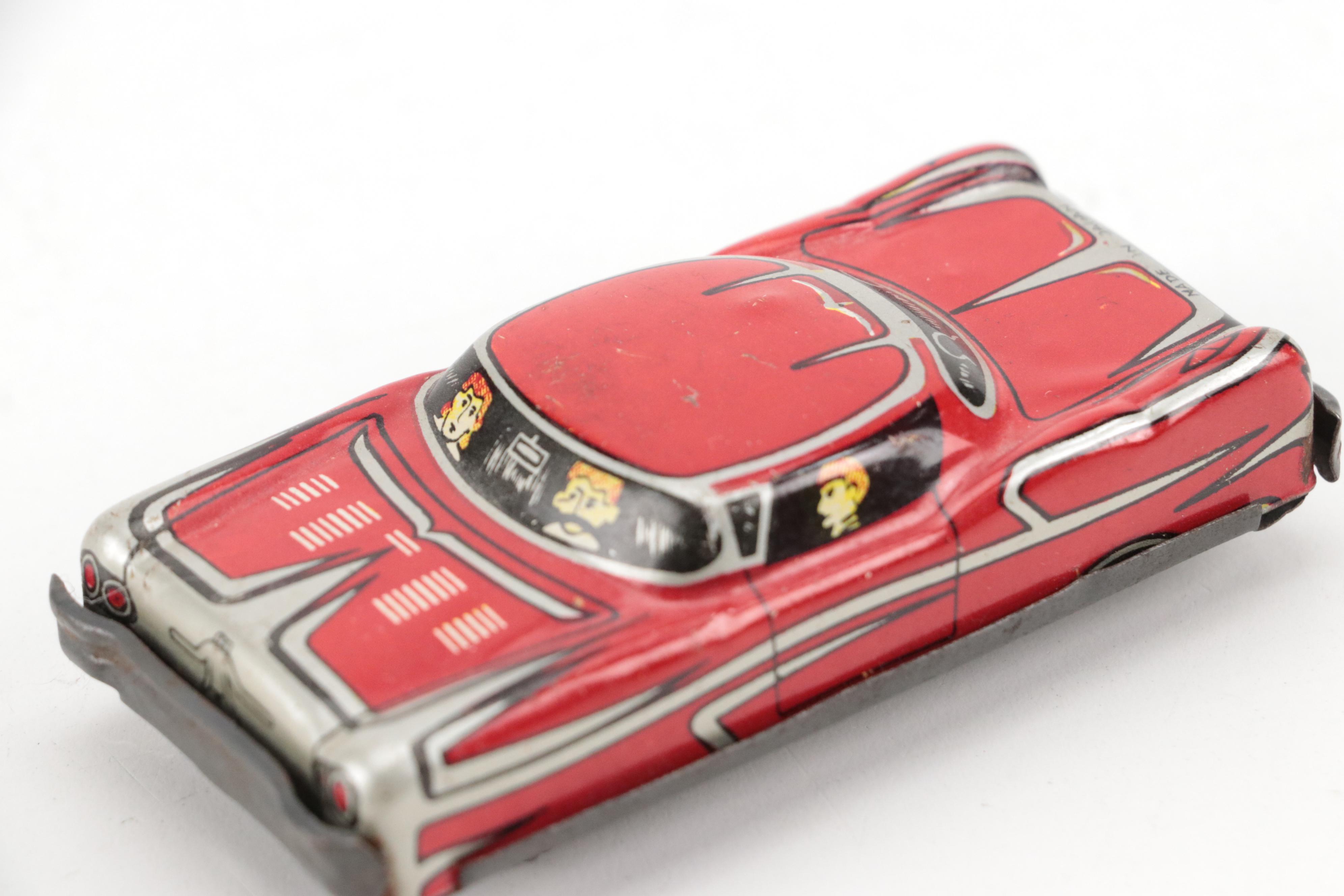 Lupor Tin Litho Perpetual Motion Police Chief Car with Other Tin Litho Cars