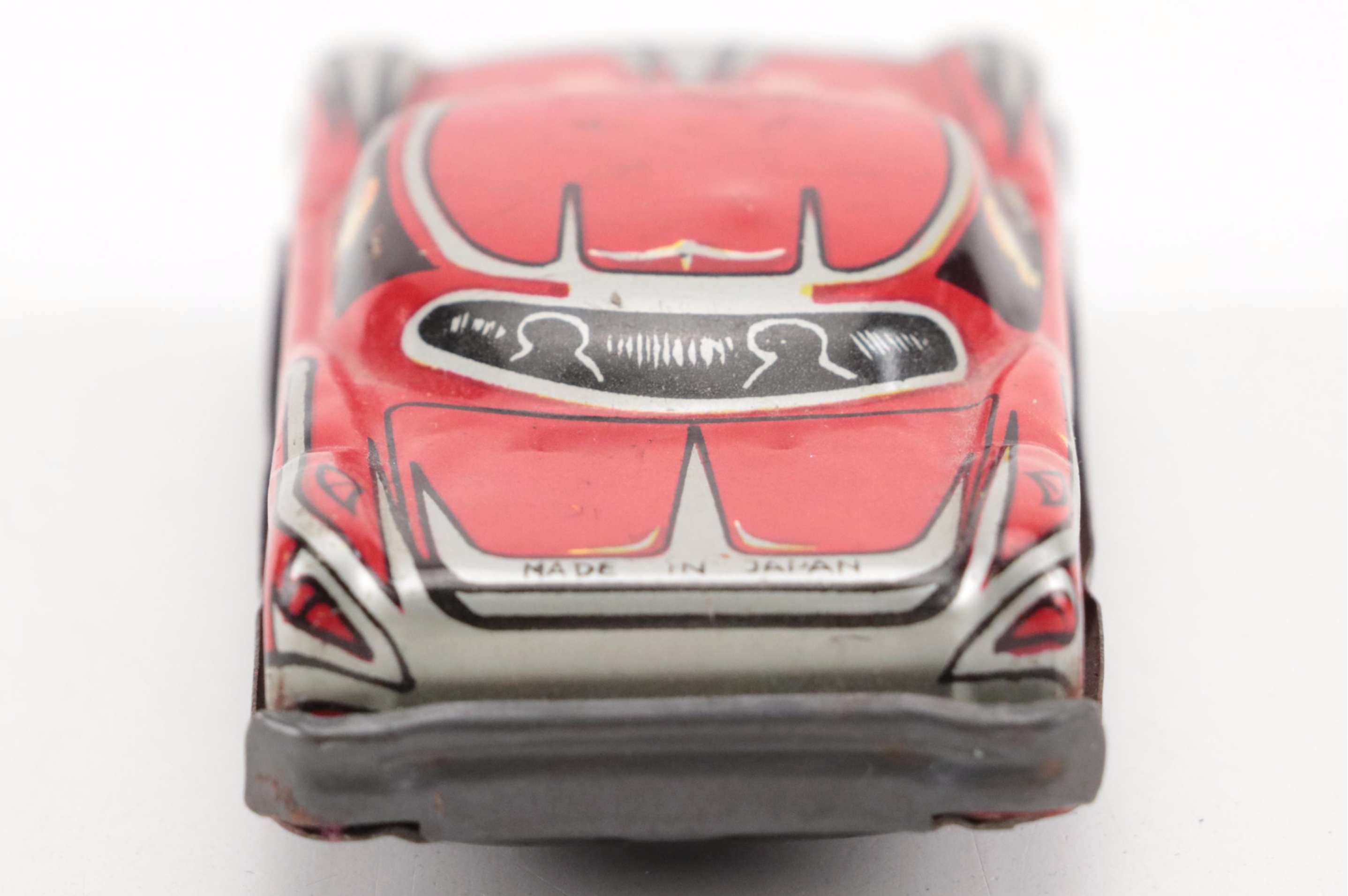 Lupor Tin Litho Perpetual Motion Police Chief Car with Other Tin Litho Cars