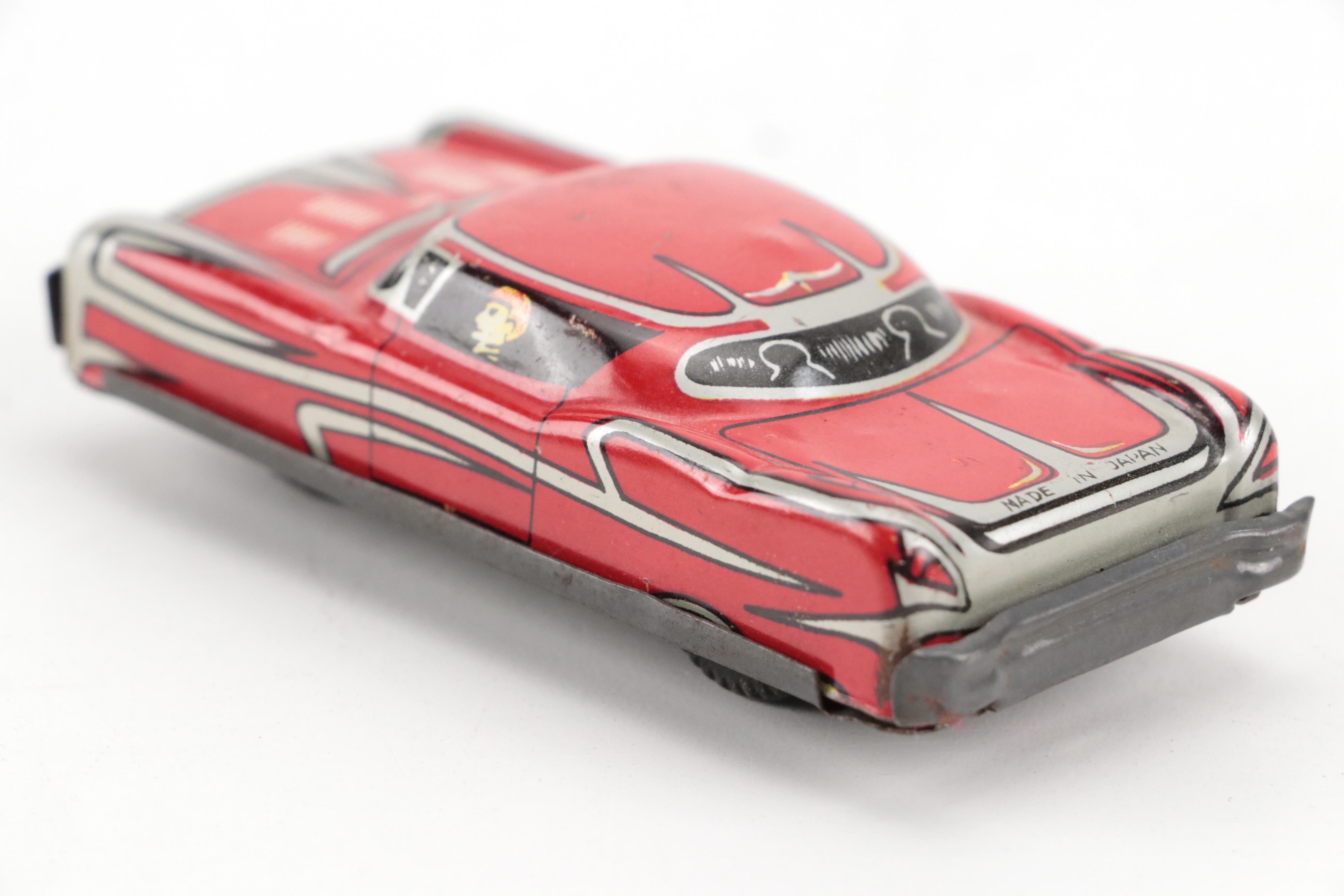 Lupor Tin Litho Perpetual Motion Police Chief Car with Other Tin Litho Cars