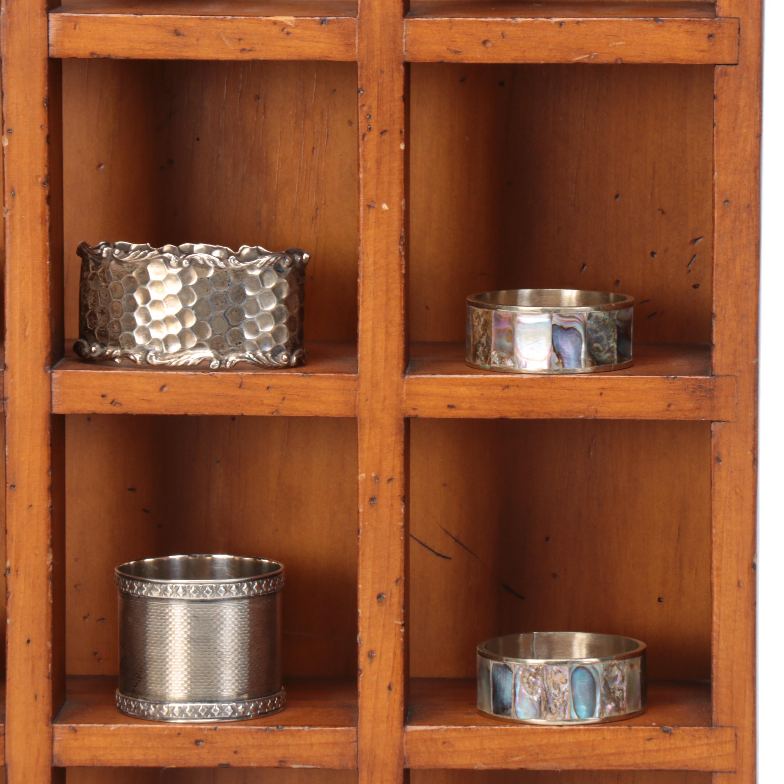 Wood Wall-Hanging Shelf with Silver Tone Metal Napkin Ring Collection and Vase