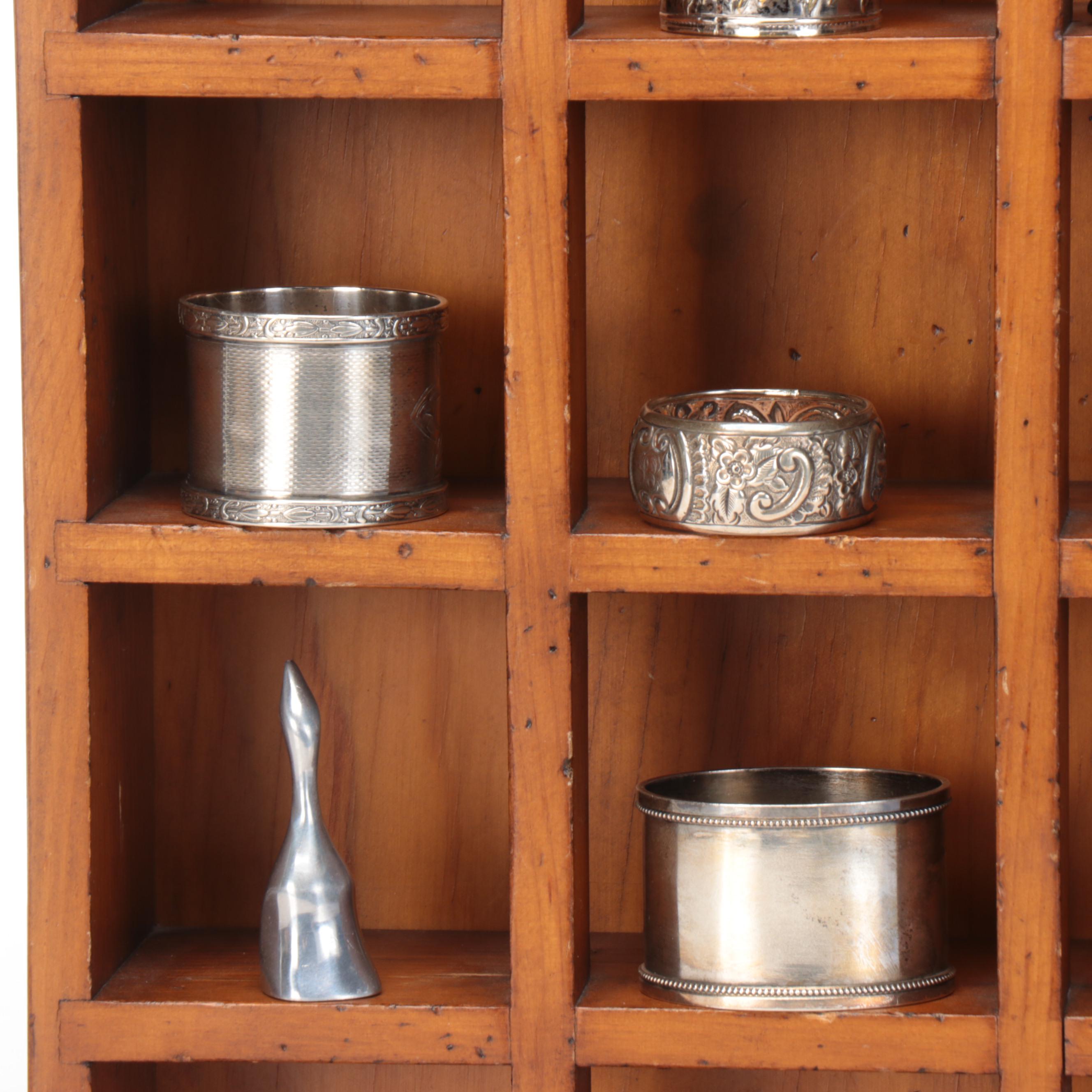 Wood Wall-Hanging Shelf with Silver Tone Metal Napkin Ring Collection and Vase