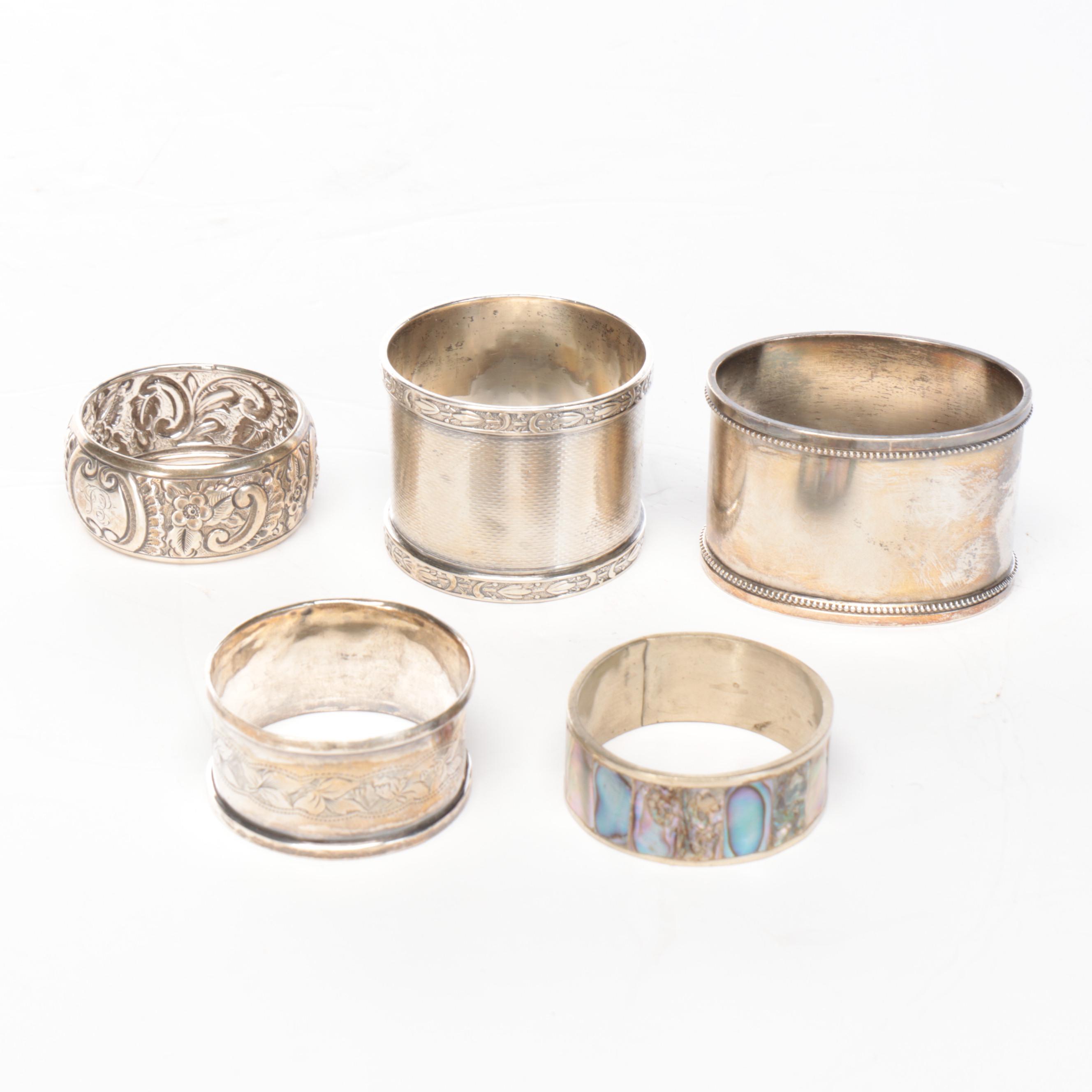 Wood Wall-Hanging Shelf with Silver Tone Metal Napkin Ring Collection and Vase